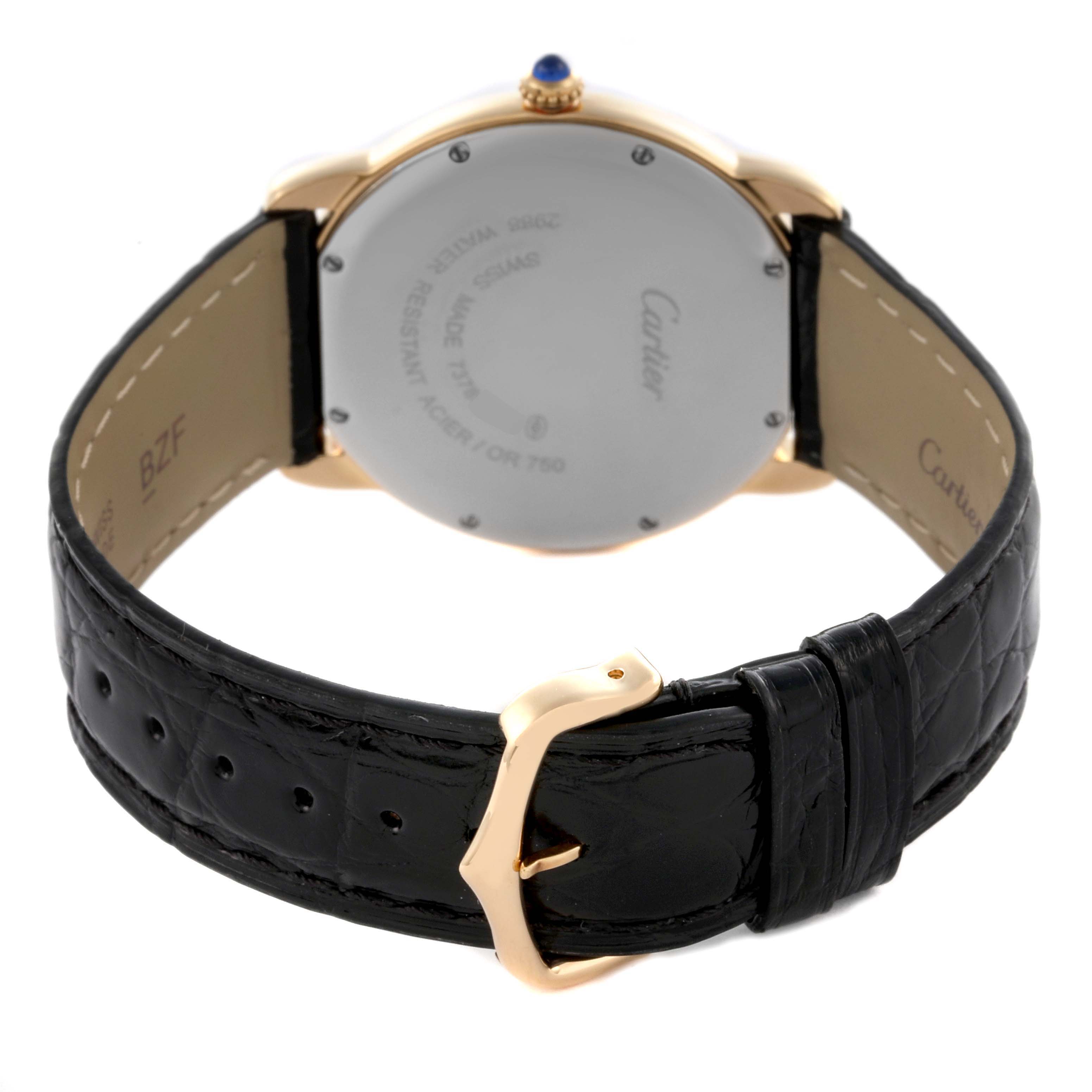 The Cartier Ronde W6700455 Men's Yellow Gold Silver Dial W6700455 Men's Yellow Gold Silver Dial watch is shown from the back, highlighting its case back and leather strap with buckle.