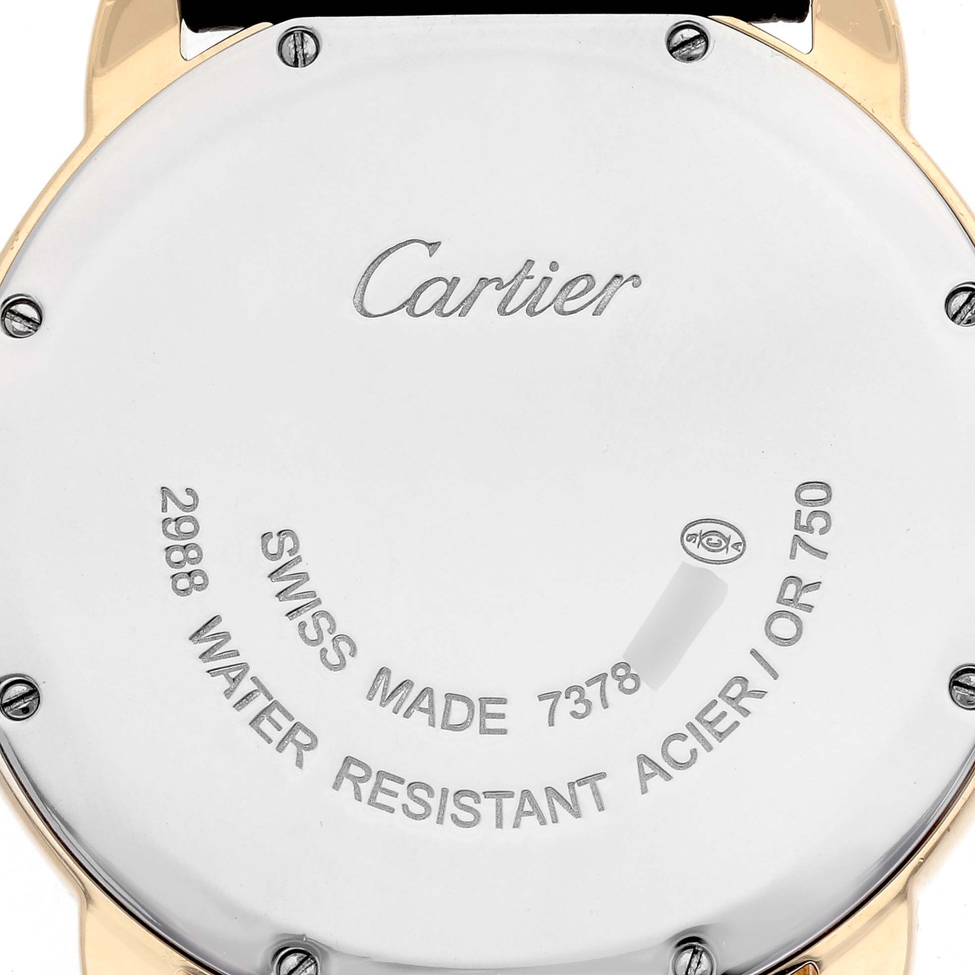 The image shows the case back of the Ronde model by Cartier, displaying engravings and screws.