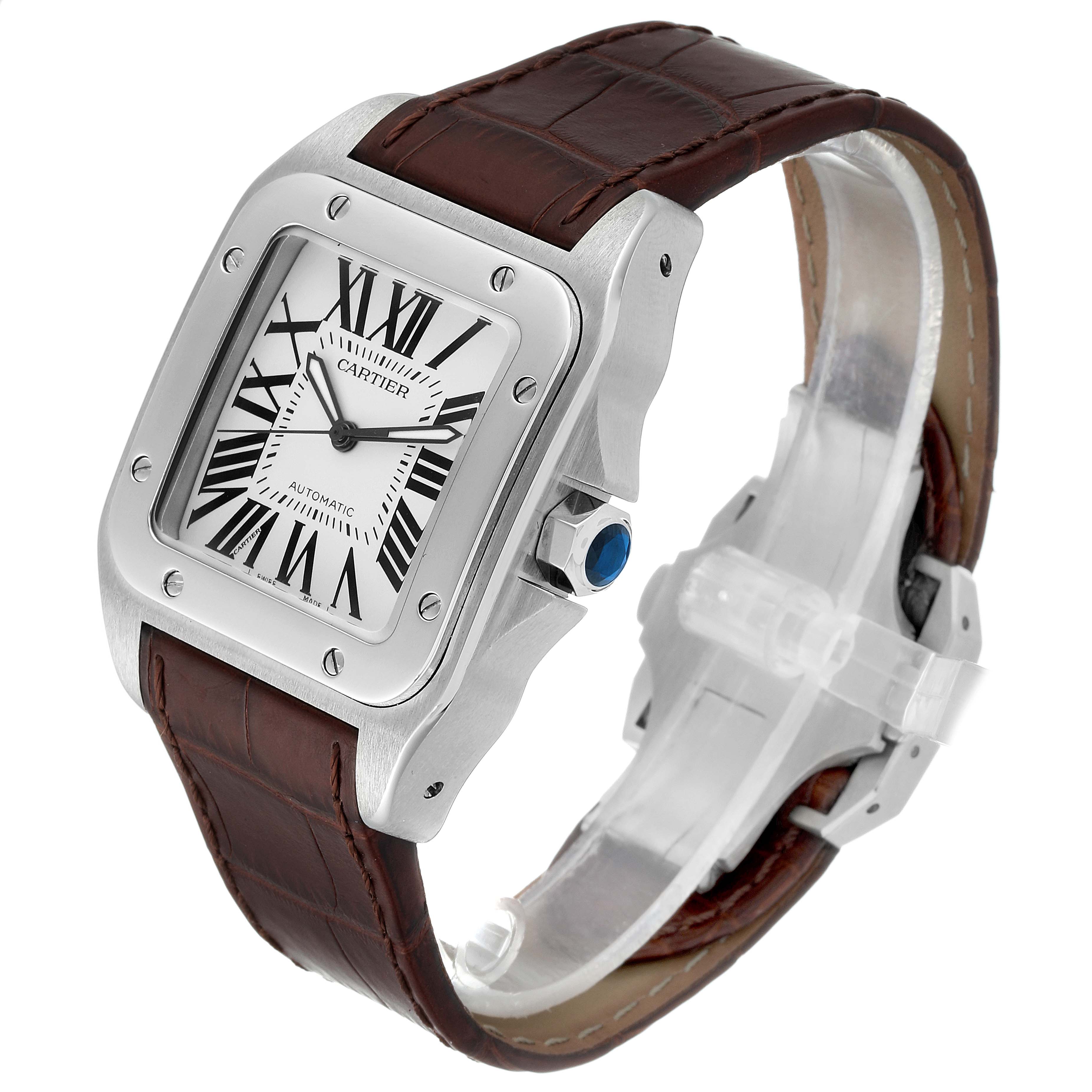 The image shows a side angle of the Cartier Santos W20073X8 Men's Stainless Steel Silver Dial W20073X8 Men's Stainless Steel Silver Dial watch, highlighting its square face, brown leather strap, and blue cabochon crown.