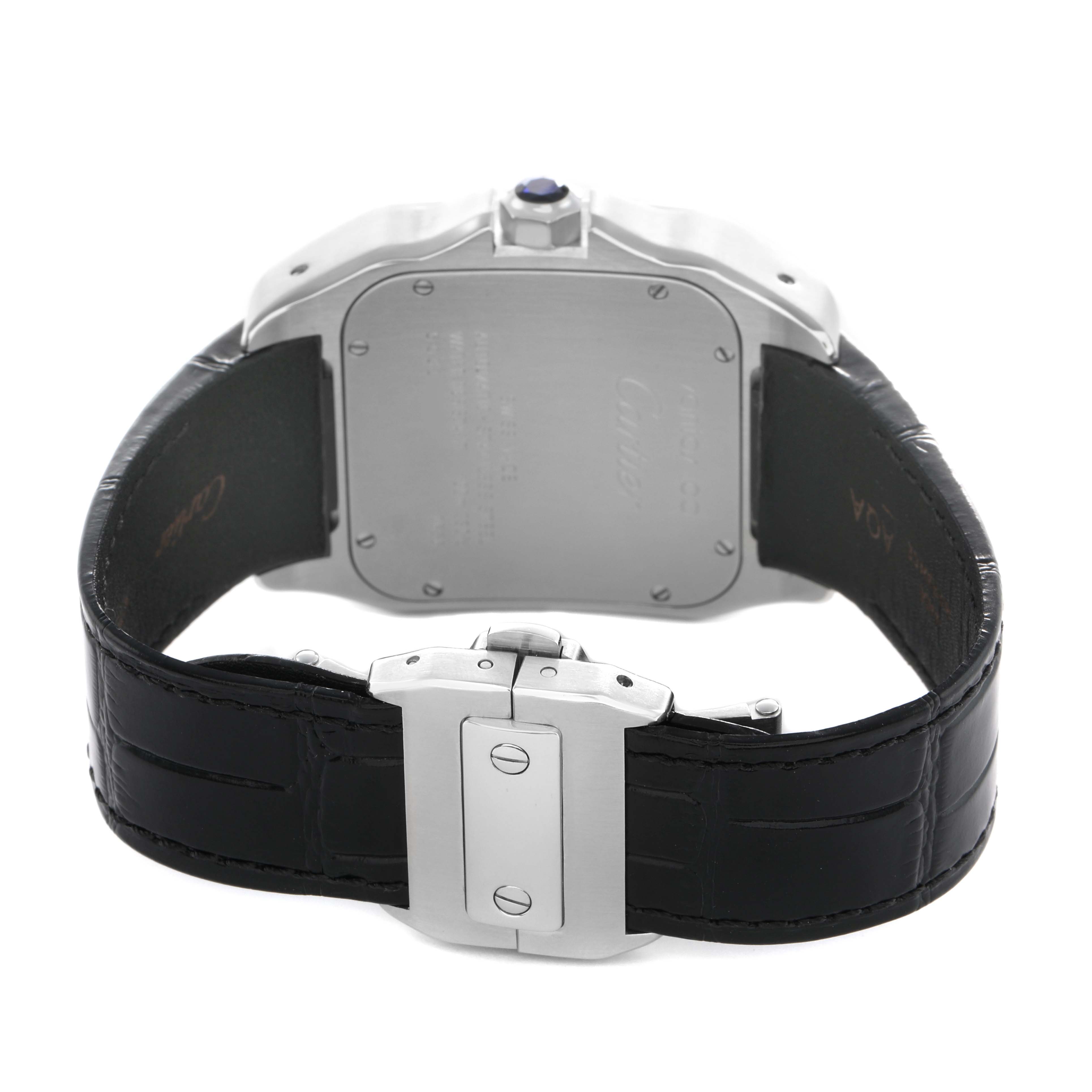 The image shows the back of the Cartier Santos W20073X8 Men's Stainless Steel Silver Dial watch, highlighting the case back, crown, and black leather strap with clasp.