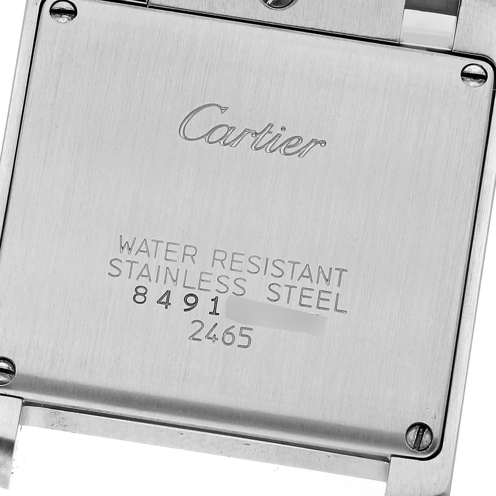 The image shows the back of a Tank Française model by Cartier, highlighting its water resistance and stainless steel details.