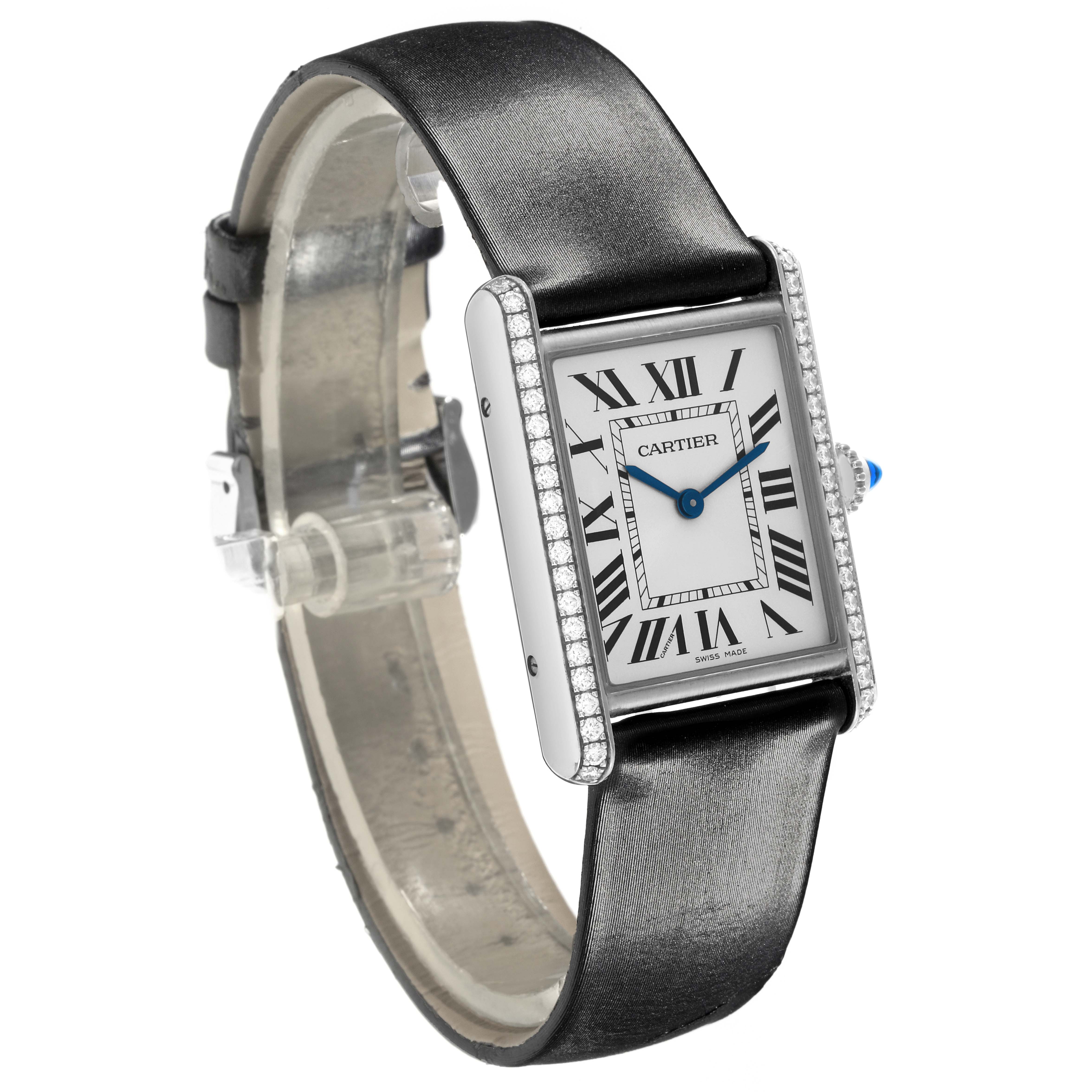 The Cartier Tank Must W4TA0017 Women
s Stainless Steel Silver Dial W4TA0017 Women
s Stainless Steel Silver Dial watch is shown at a three-quarter angle, highlighting its rectangular face and black leather strap.