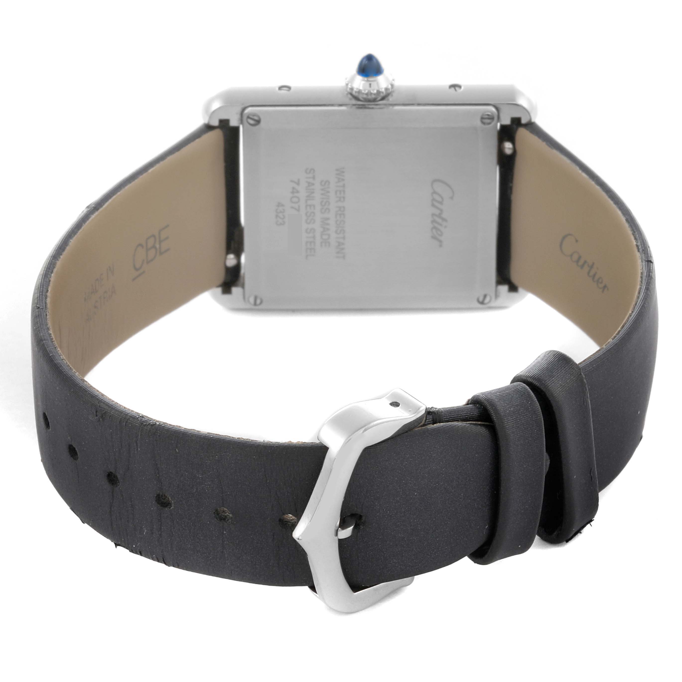 The Cartier Tank Must W4TA0017 Women
s Stainless Steel Silver Dial W4TA0017 Women
s Stainless Steel Silver Dial watch is shown from the back, displaying the case back, strap, and buckle.