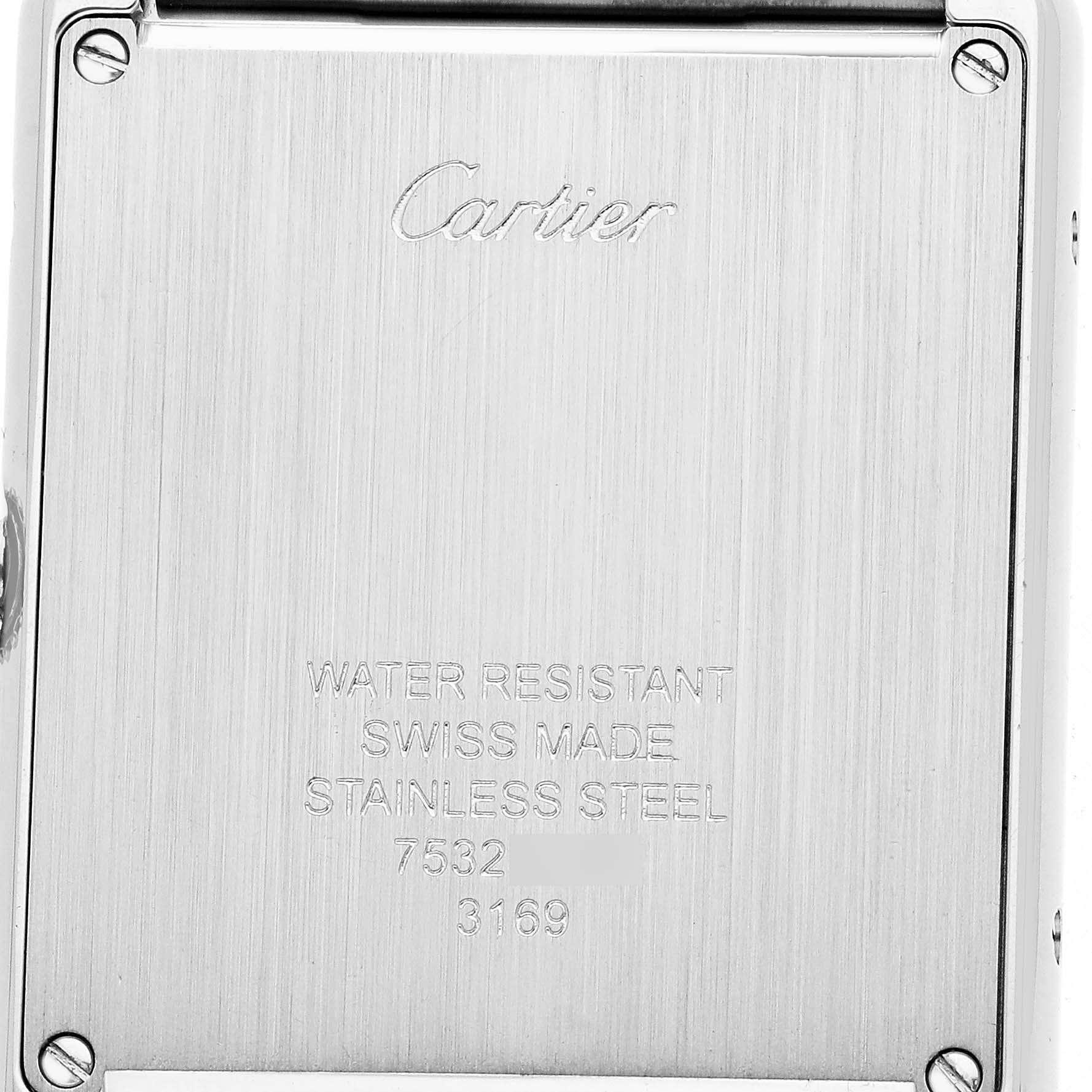 The image shows the back of a Tank Solo watch by Cartier, highlighting its stainless steel case and engravings.
