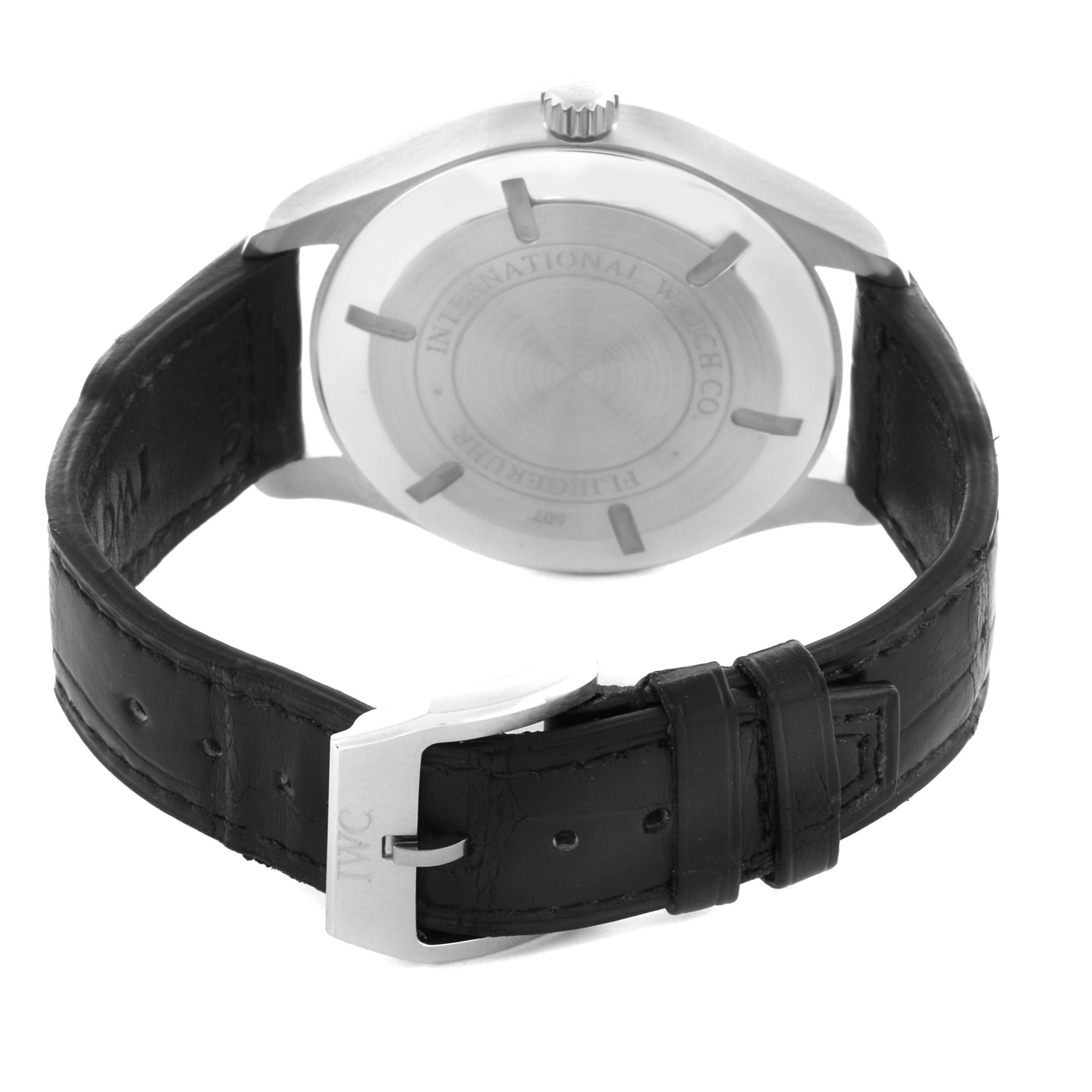 The photo shows the back of the IWC Pilot IW326501 Men's Stainless Steel Black Dial IW326501 Men's Stainless Steel Black Dial watch and its leather strap with a buckle.