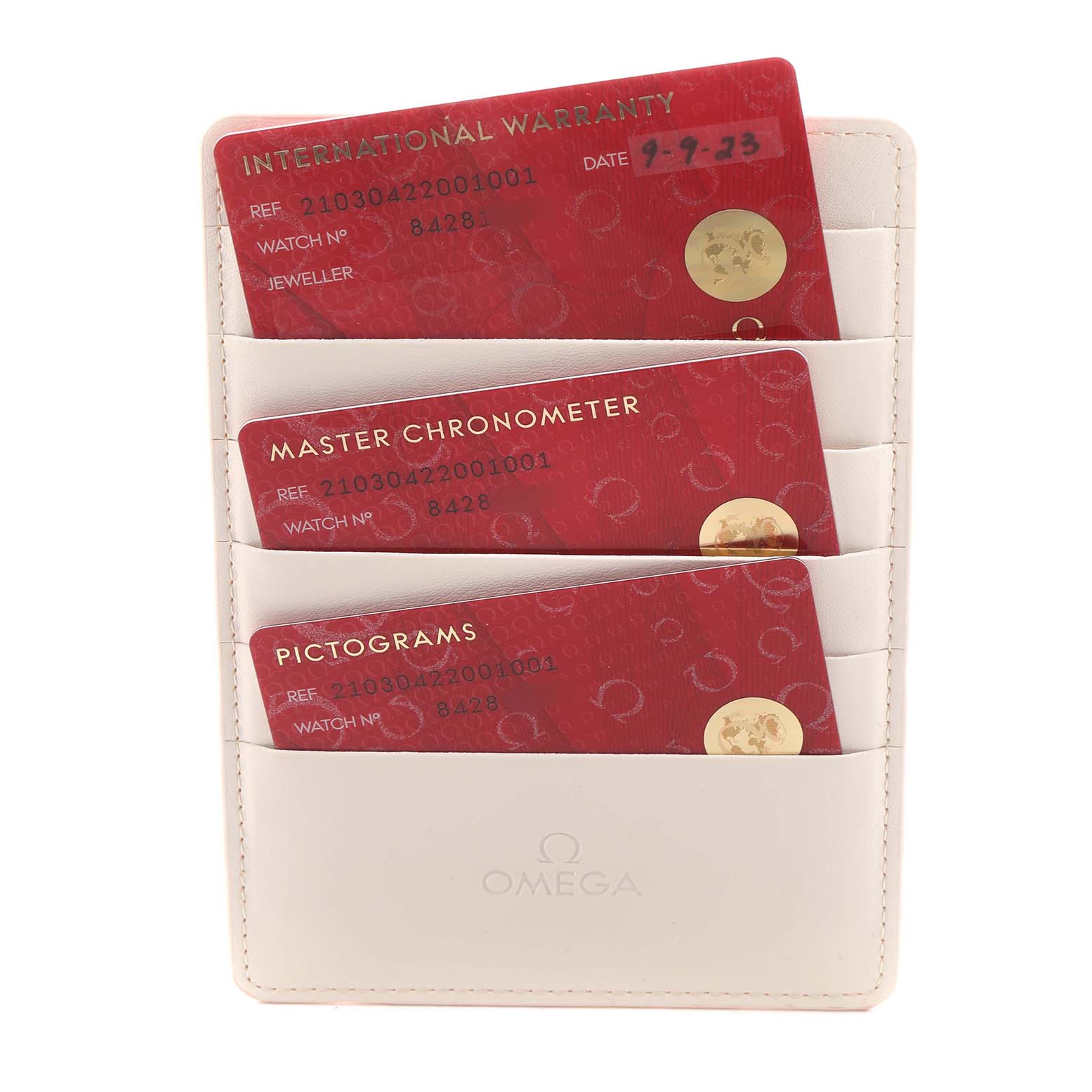 The image shows warranty cards for the Omega Seamaster 210.30.42.20.01.001 Men's Stainless Steel Black Dial, arranged in a white card holder.