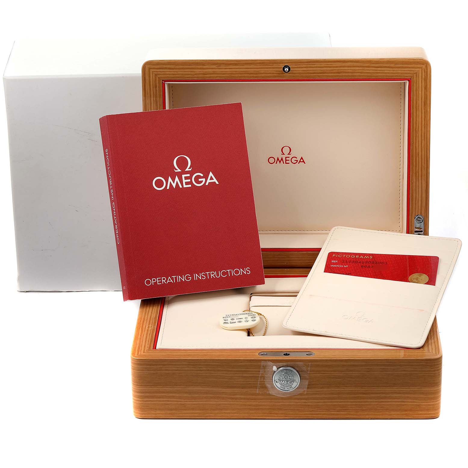The image shows an open Omega Seamaster 212.30.41.20.03.001 Men's Stainless Steel Blue Dial 212.30.41.20.03.001 Men's Stainless Steel Blue Dial watch box with the operating instructions and a warranty card pouch placed inside.