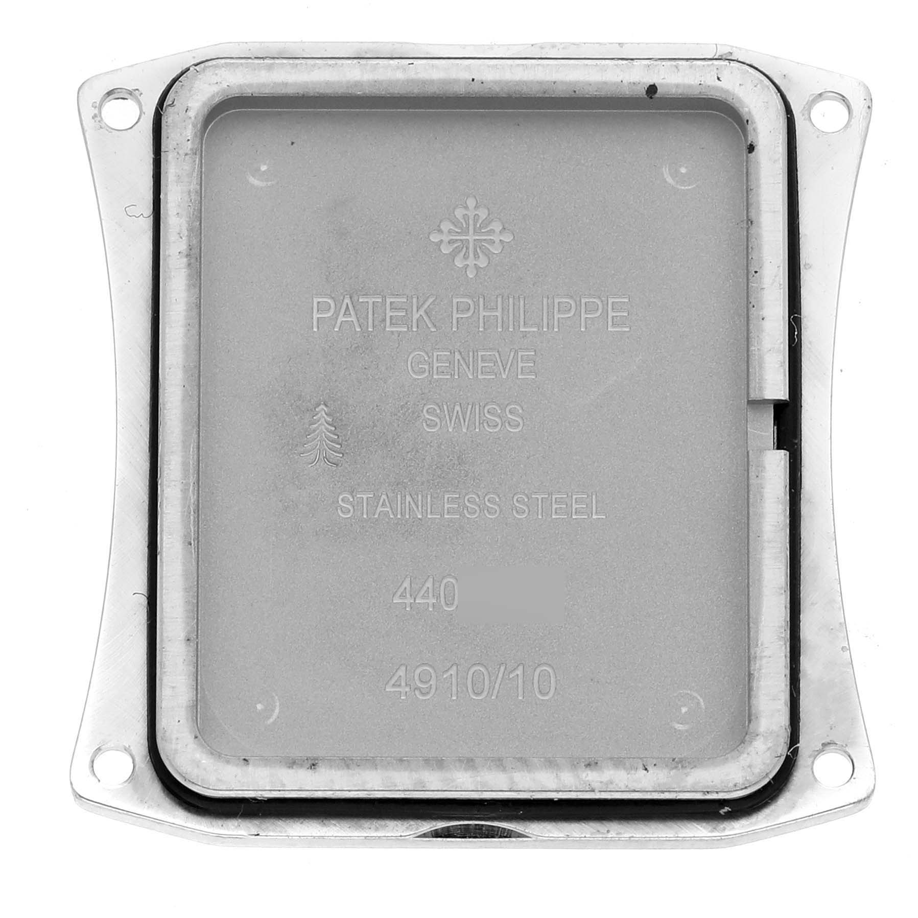 The image shows the back cover of a Patek Philippe Twenty-4 4910/10A-001 Women's Stainless Steel Black Dial 4910/10A-001 Women's Stainless Steel Black Dial watch, highlighting its stainless steel material.