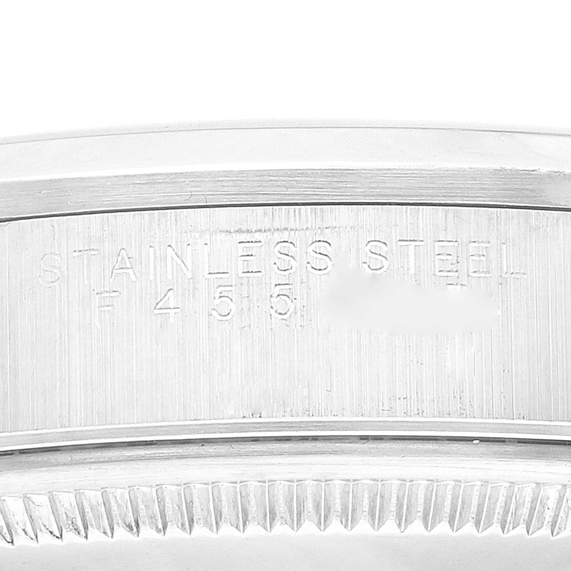 This image shows a close-up view of the side engravings on a Rolex Air-King 14000 Men's Stainless Steel Blue Dial 14000 Men's Stainless Steel Blue Dial model, highlighting the stainless steel marking.