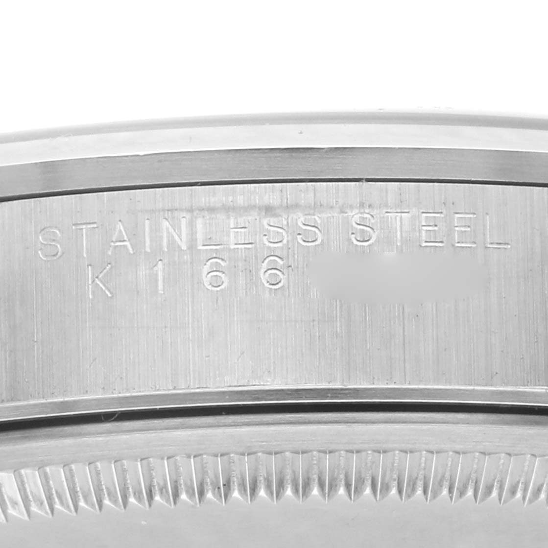 The image shows a close-up angle of the edge of a Rolex Air-King 14000 Men's Stainless Steel Silver Dial 14000 Men's Stainless Steel Silver Dial watch, highlighting the stainless steel bezel and engraved text.