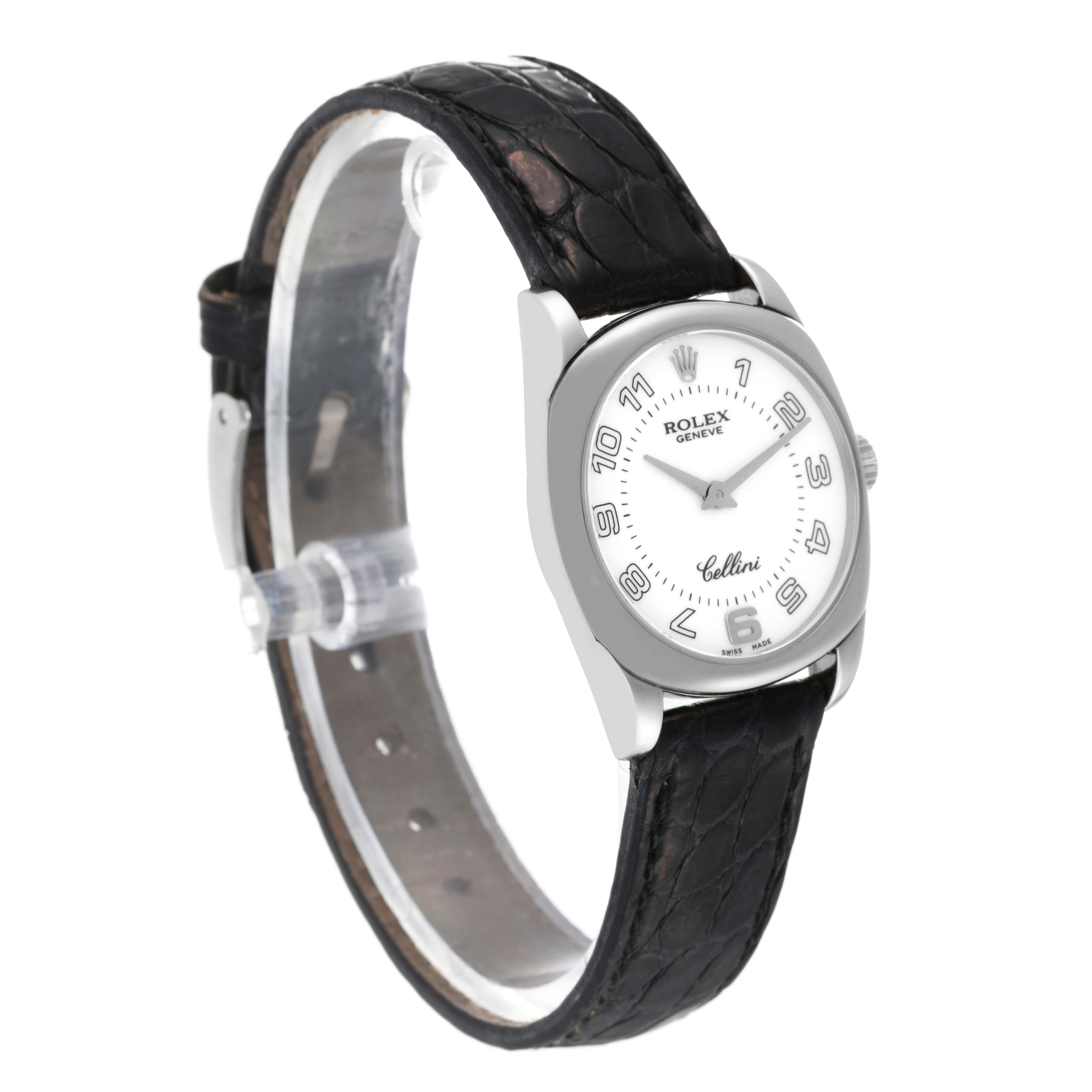 This is a side angle view of a Rolex Cellini 6229 Women's White Gold White Dial 6229 Women's White Gold White Dial watch, showing its face and black leather strap.