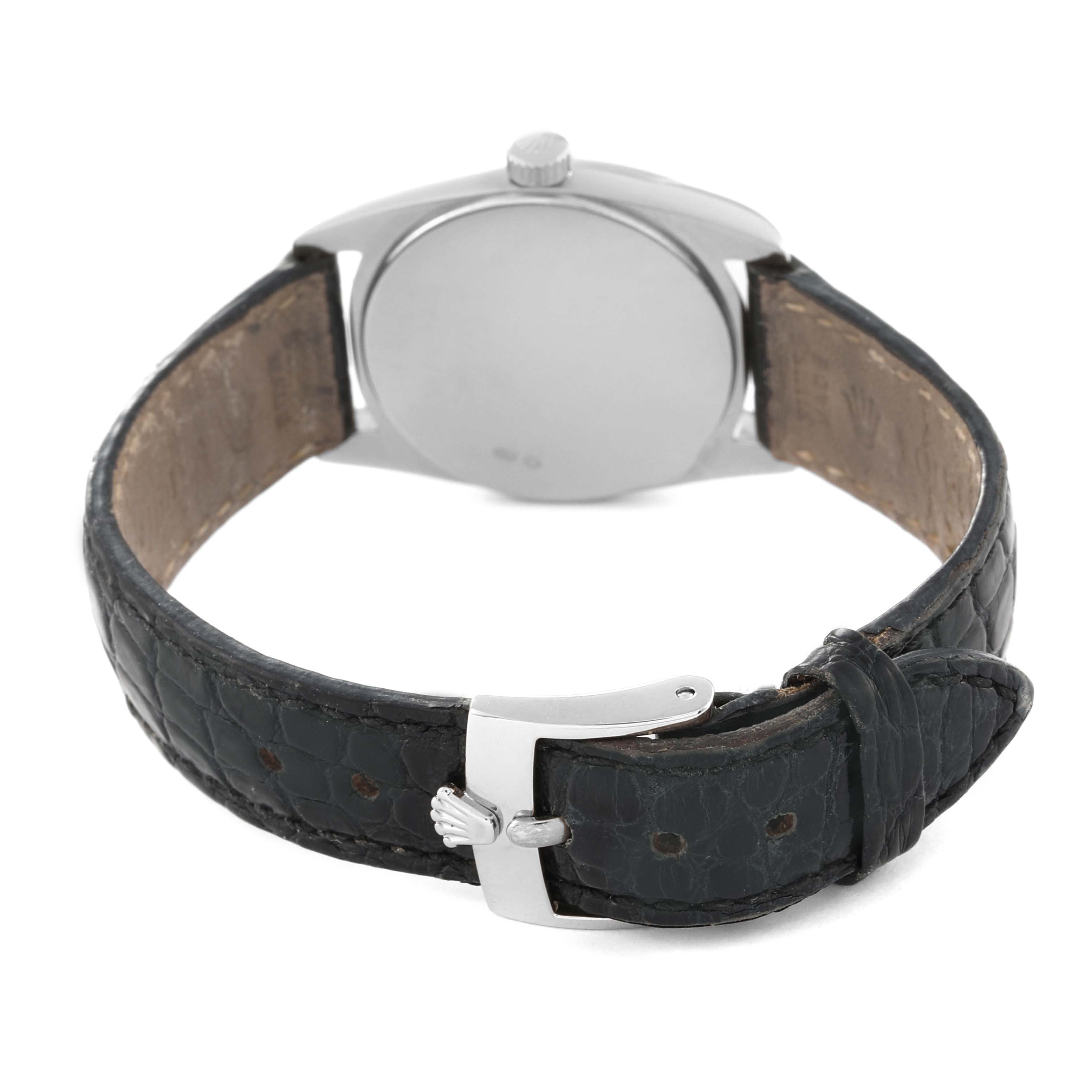 The image shows the back view of a Rolex Cellini 6229 Women's White Gold White Dial 6229 Women's White Gold White Dial watch, highlighting its leather strap and clasp.