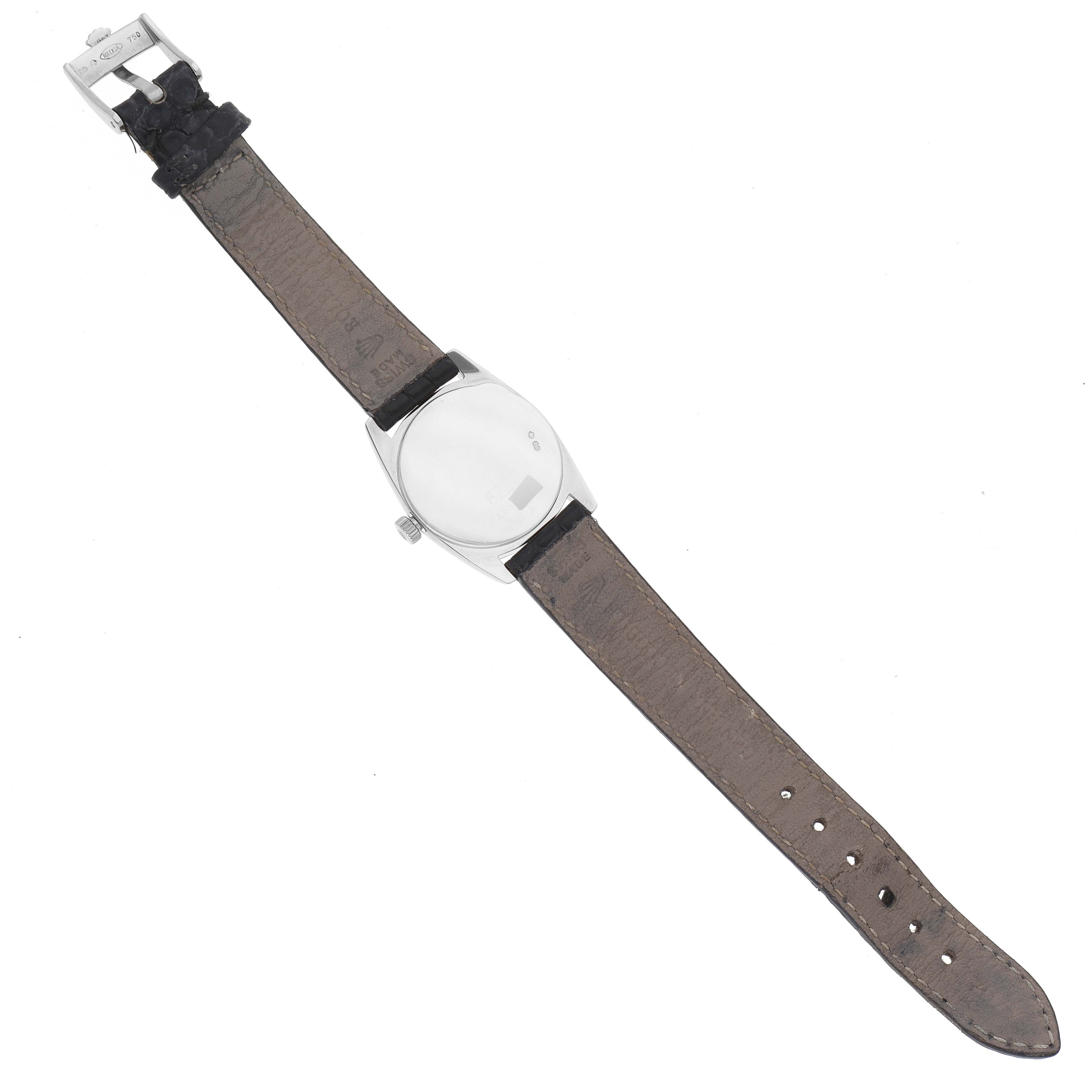 The image shows the underside of a Rolex Cellini 6229 Women's White Gold White Dial 6229 Women's White Gold White Dial watch, including the back case, leather strap, and buckle.