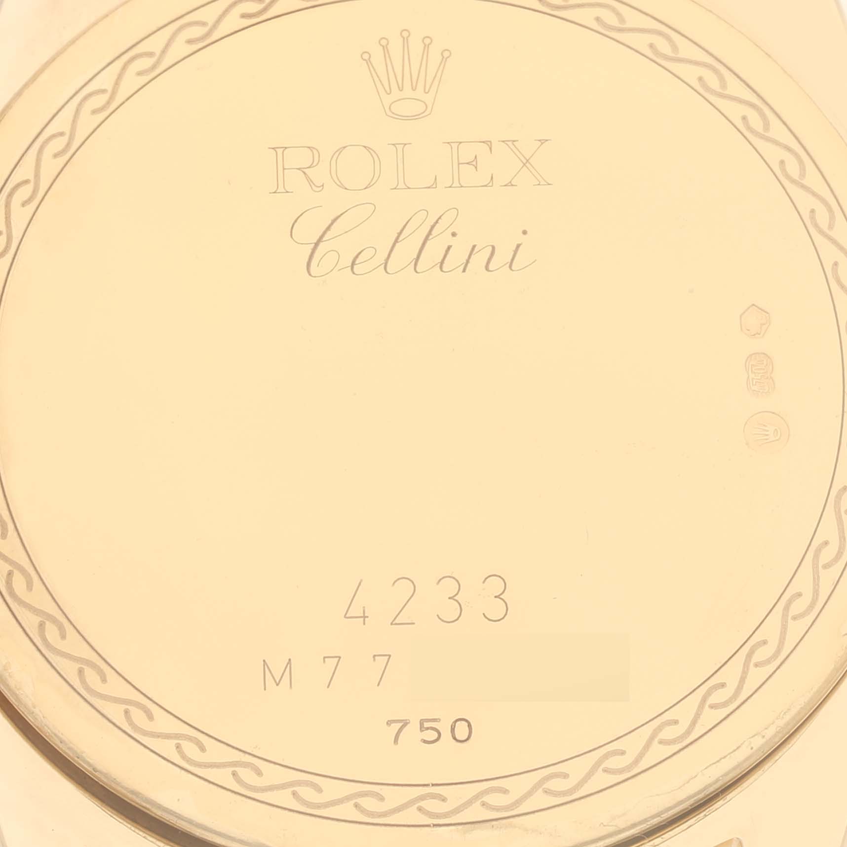 This image shows the back case of a Rolex Cellini 4233 Men's Yellow Gold Black Dial 4233 Men's Yellow Gold Black Dial watch engraved with the model name, brand, and other inscriptions.