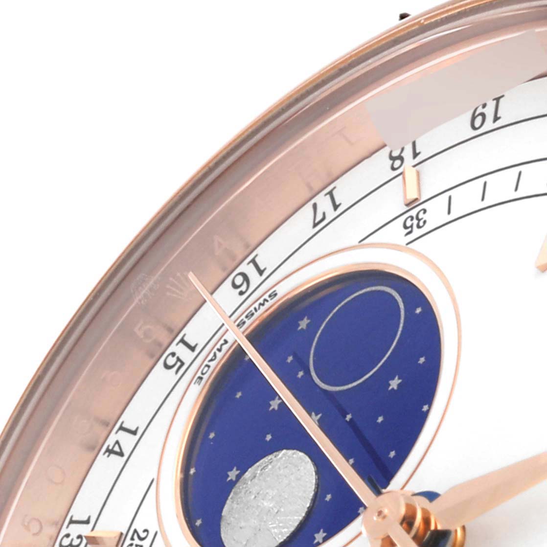 Close-up of the upper right portion of the Rolex Cellini 50535 Men's Rose Gold White Dial 50535 Men's Rose Gold White Dial watch, showing the moonphase display and part of the hour markers.