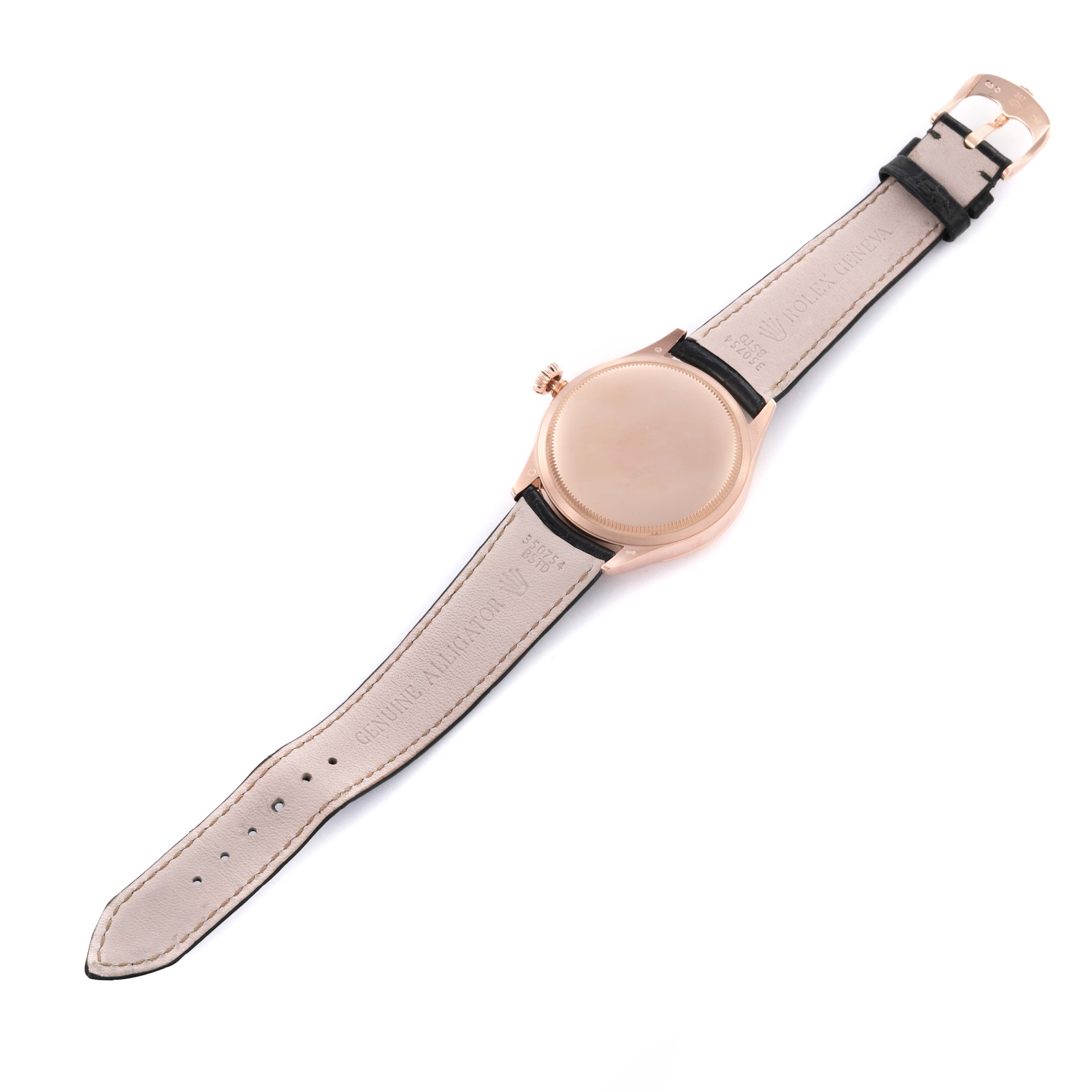 The image shows the back view of the Rolex Cellini 50505 Men's Rose Gold Pink Dial 50505 Men's Rose Gold Pink Dial watch with its leather strap and clasp.