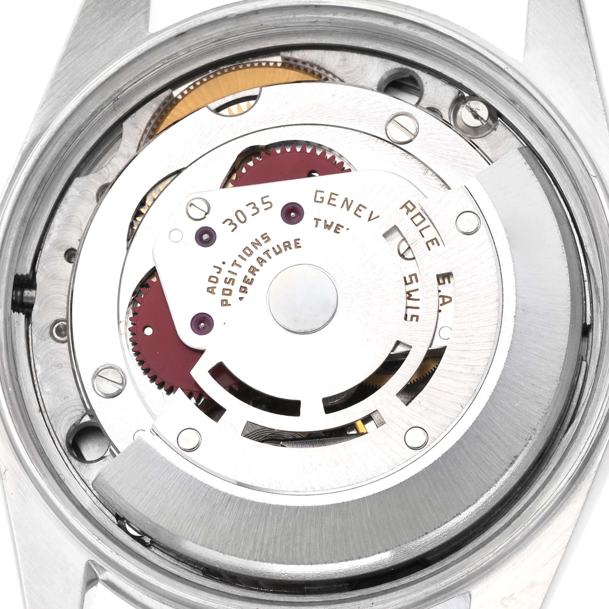 The image shows the movement of a Rolex Vintage Collection 15000 Men's Stainless Steel Silver Dial 15000 Men's Stainless Steel Silver Dial watch from the back, highlighting gears and inscriptions.