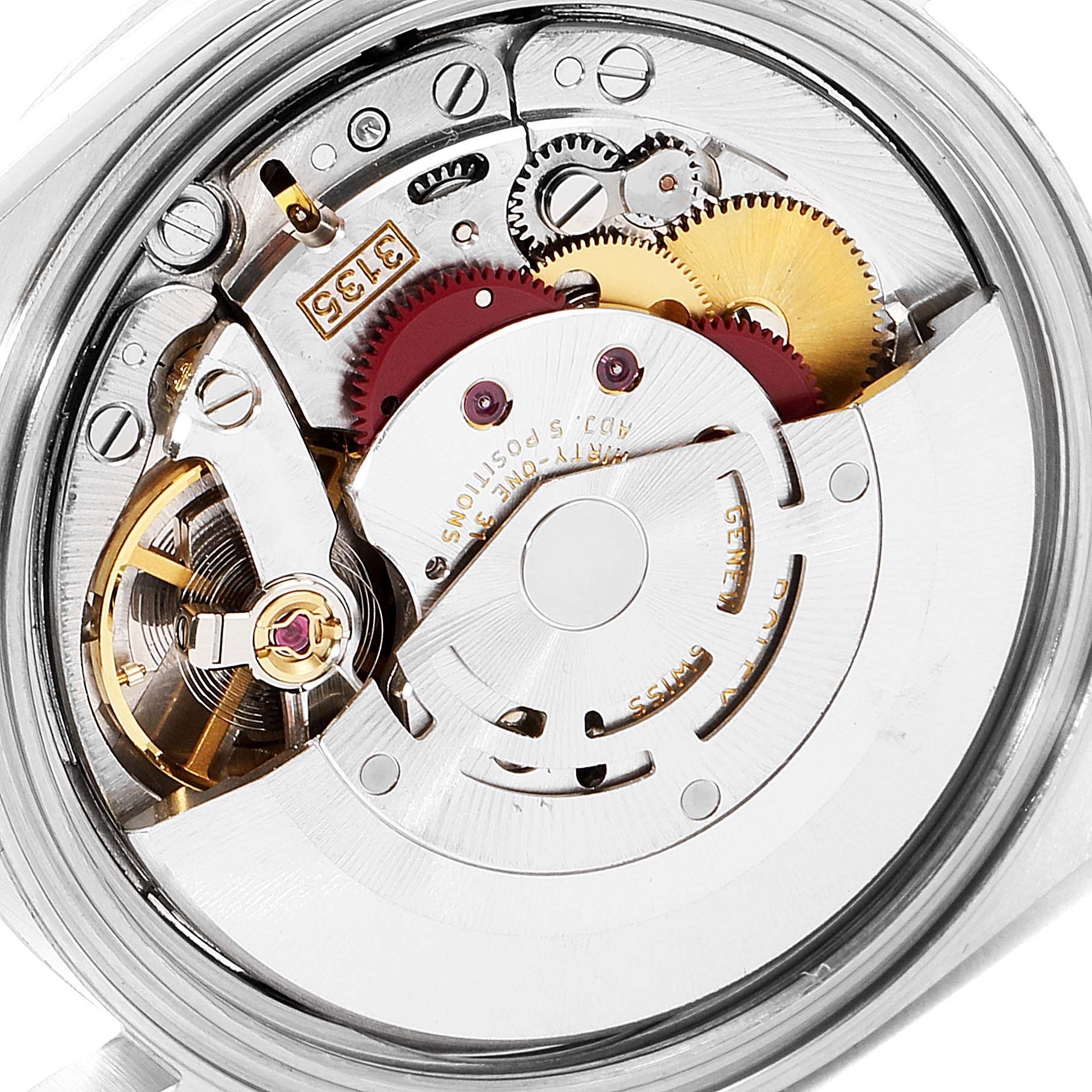 This image shows the intricate internal mechanics and movement of a Rolex Datejust 16220 Men's Stainless Steel Pink Dial 16220 Men's Stainless Steel Pink Dial watch from a close-up angle.