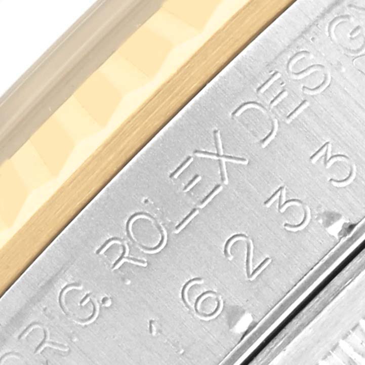 The image shows a close-up of the engraved clasp of a Rolex Datejust 16233 Men's Steel and Gold (two tone) Black Dial 16233 Men's Steel and Gold (two tone) Black Dial watch.