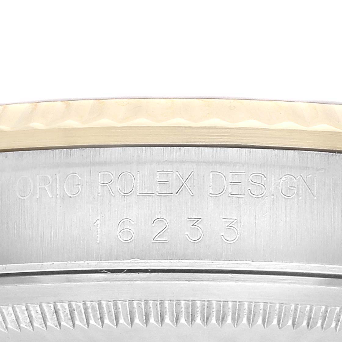 This image shows the side engraving and edge of the bezel on a Rolex Datejust 16233 Men's Steel and Gold (two tone) Champagne Dial model.