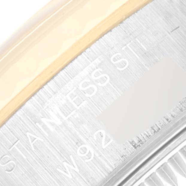 The image shows an extreme close-up view of the side of the Rolex Datejust 69173 Women's Steel and Gold (two tone) Champagne Dial 69173 Women's Steel and Gold (two tone) Champagne Dial watch case, revealing stainless steel markings.