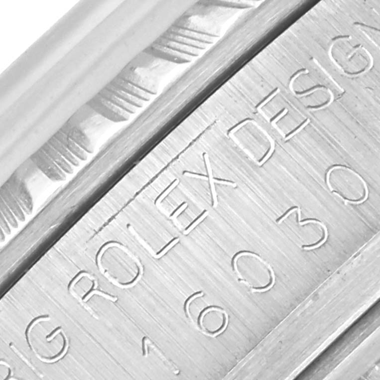 The image shows a close-up of the engravings on a Rolex Vintage Collection 16030 Men's Stainless Steel Silver Dial 16030 Men's Stainless Steel Silver Dial model's case side.