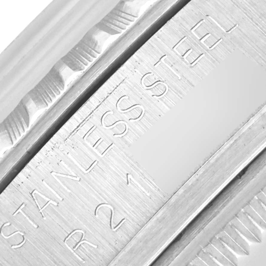 The image shows a close-up of the bezel and engraved serial number of a Rolex Vintage Collection 16030 Men's Stainless Steel Silver Dial 16030 Men's Stainless Steel Silver Dial watch.