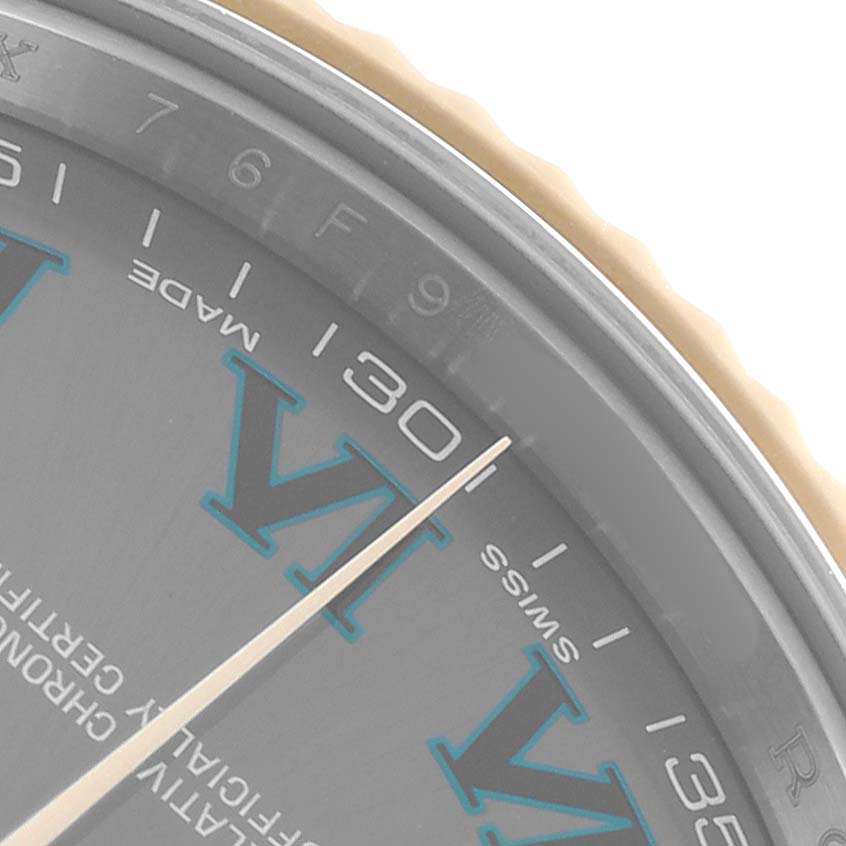 The image shows a close-up of the Rolex Datejust 41 116333 Men's Steel and Gold (two tone) Grey Dial's dial, highlighting the hour markers, Roman numerals, and part of the bezel.