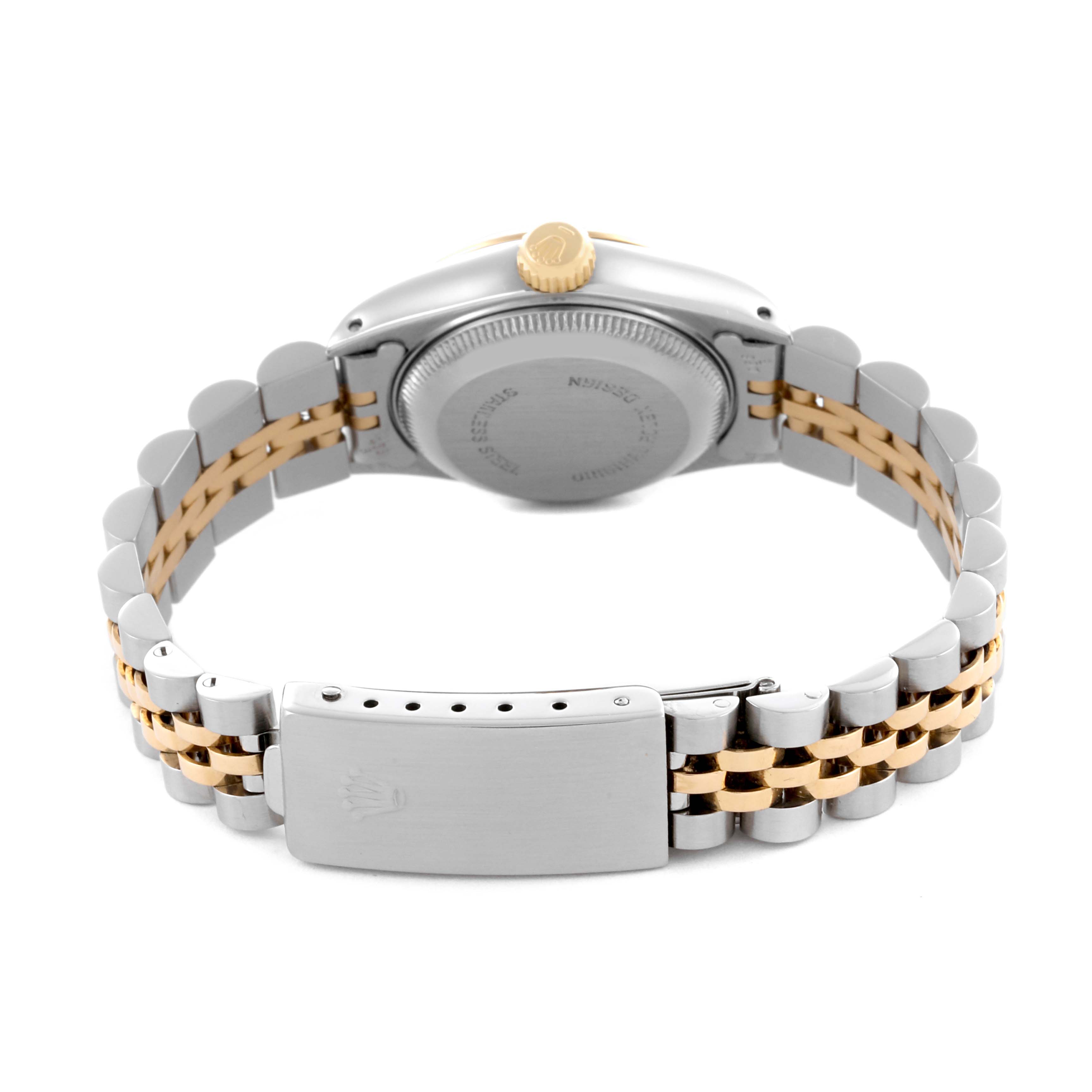 The watch is a Rolex Datejust 69173 Women's Steel and Gold (two tone) Beige Dial 69173 Women's Steel and Gold (two tone) Beige Dial, shown from the back, featuring the case back, bracelet, and clasp.