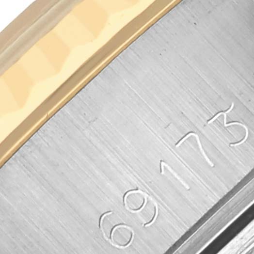 The image shows a close-up of the model number engraved on the case side of a Rolex Datejust 69173 Women's Steel and Gold (two tone) Beige Dial 69173 Women's Steel and Gold (two tone) Beige Dial watch.