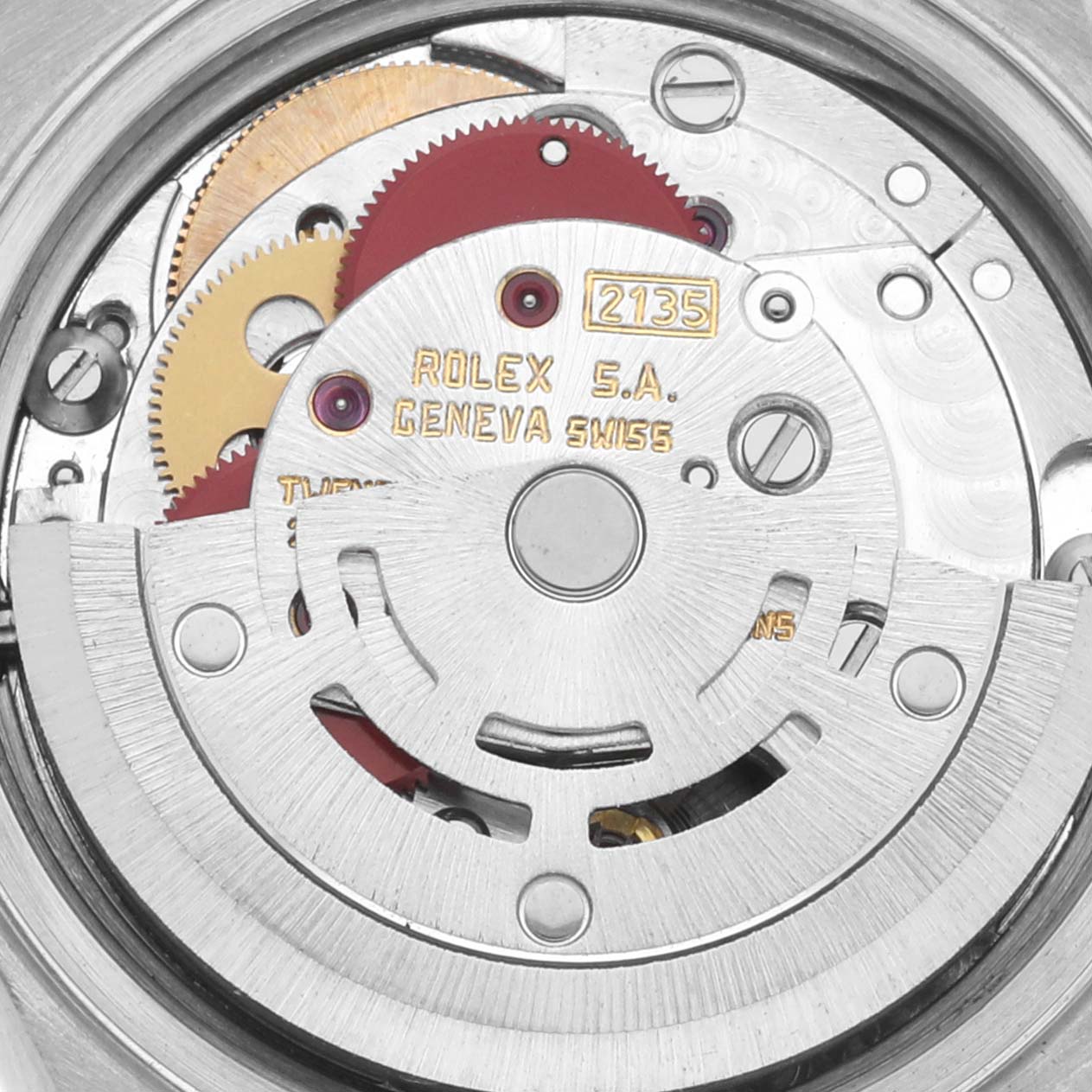 The image shows the inner mechanism of a Rolex Datejust 69173 Women's Steel and Gold (two tone) Beige Dial 69173 Women's Steel and Gold (two tone) Beige Dial, focusing on the gears and components of the movement.