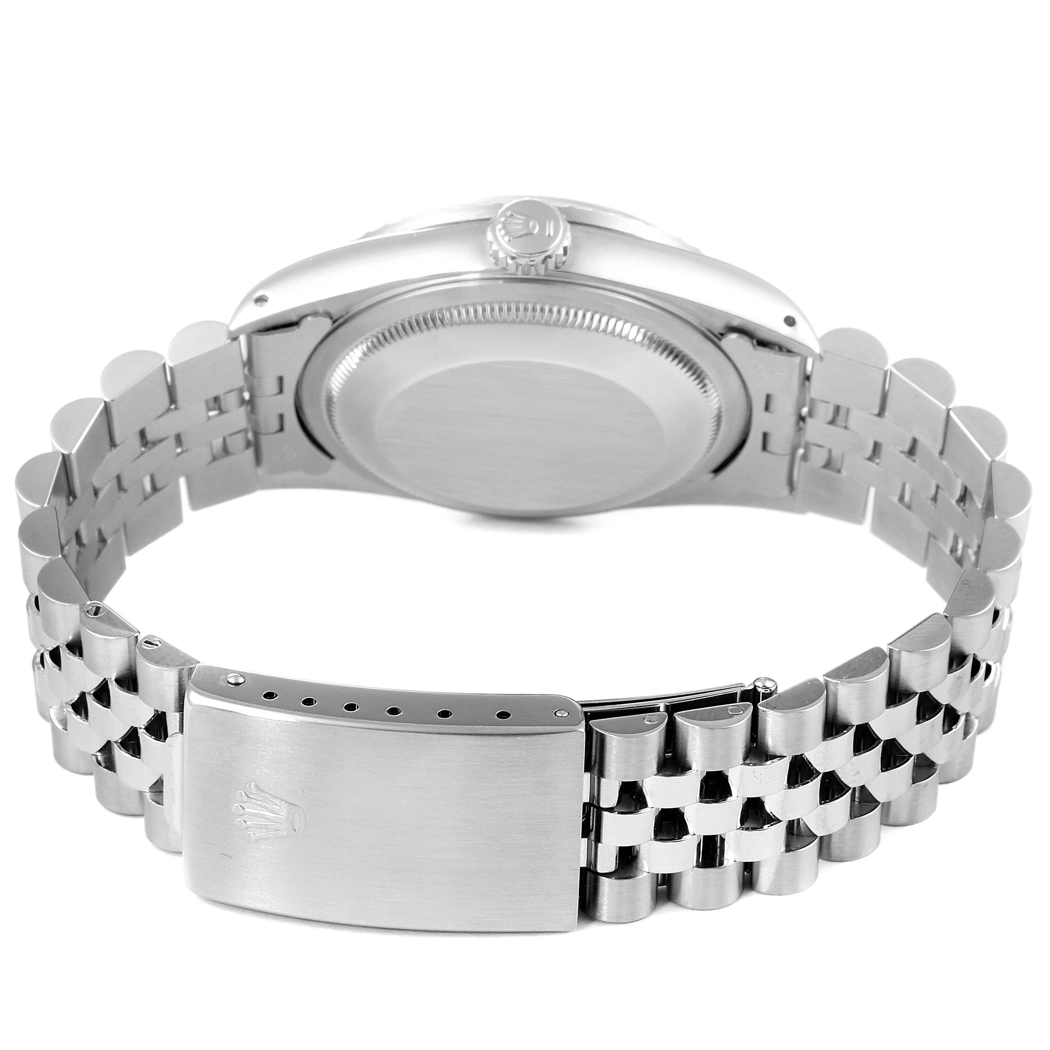 The image shows the back view of a Rolex Datejust 16220 Men's Stainless Steel Silver Dial 16220 Men's Stainless Steel Silver Dial watch, highlighting its bracelet and clasp mechanism.