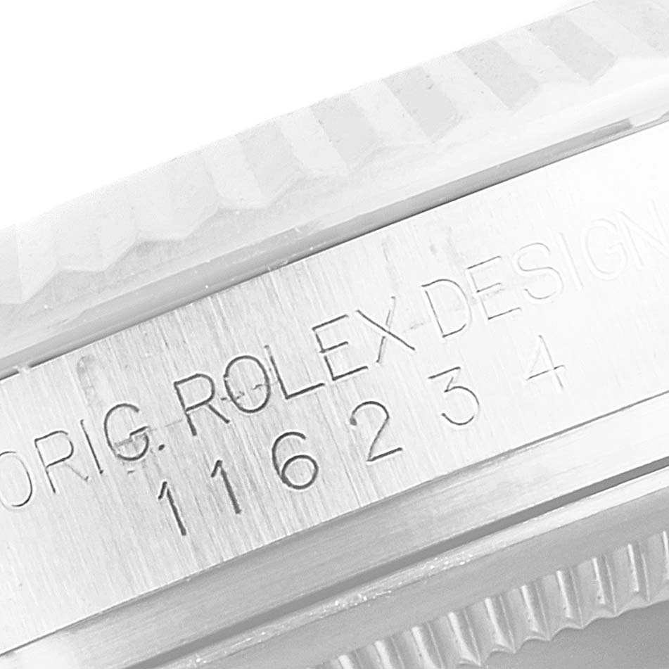This image shows a close-up of the Rolex Datejust 116234 Men
s Stainless Steel Silver Dial 116234 Men
s Stainless Steel Silver Dial model
s case, specifically highlighting the engraving on the side.