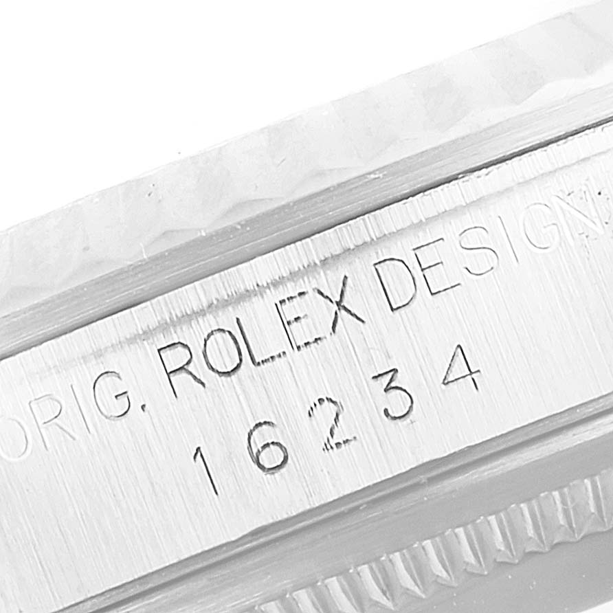 This image shows a close-up of the engravings on the case side of a Rolex Datejust 16234 Men's Stainless Steel Silver Dial 16234 Men's Stainless Steel Silver Dial model 16234.