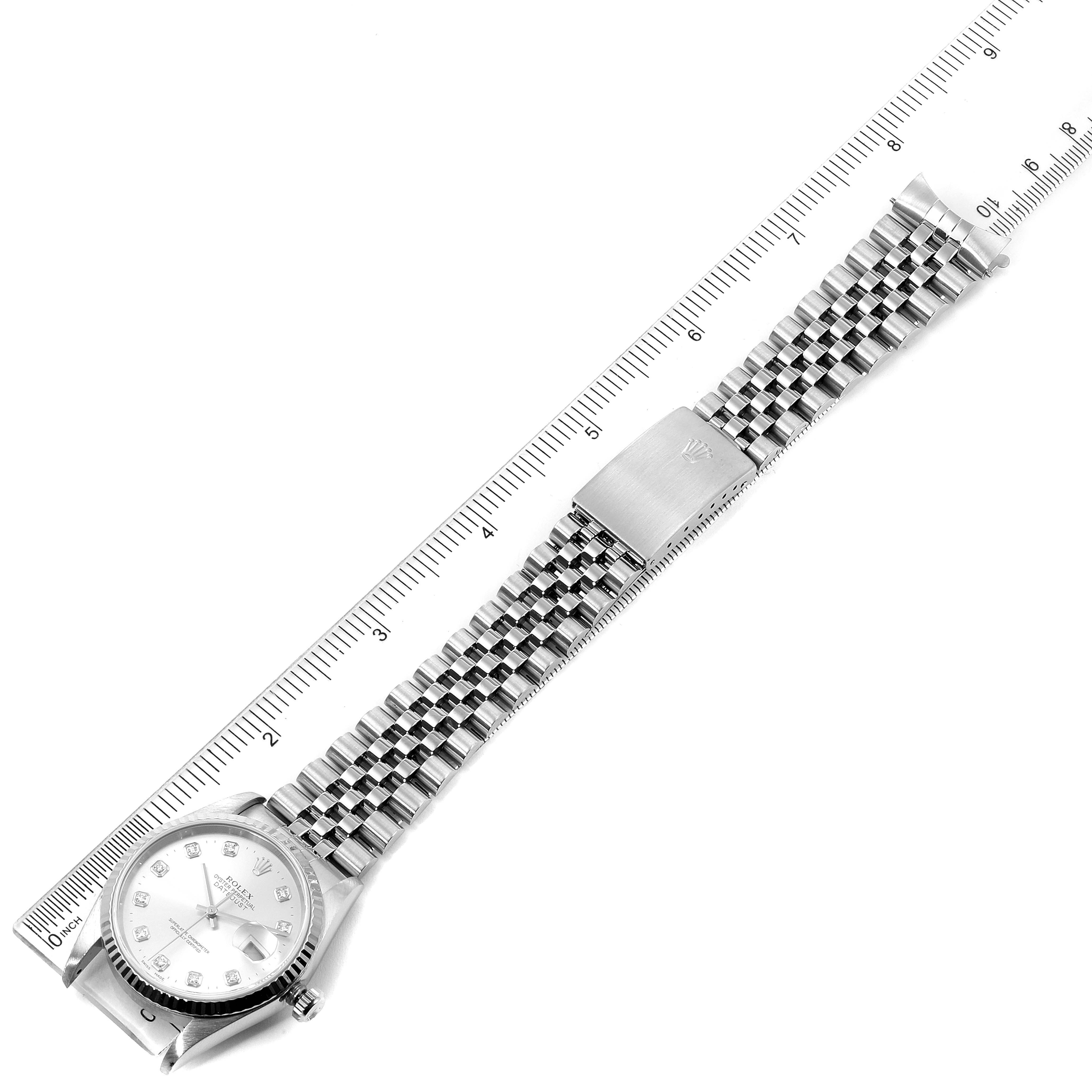 The image shows a Rolex Datejust 16234 Men's Stainless Steel Silver Dial 16234 Men's Stainless Steel Silver Dial watch laid flat with its bracelet extended alongside a ruler for measurement.