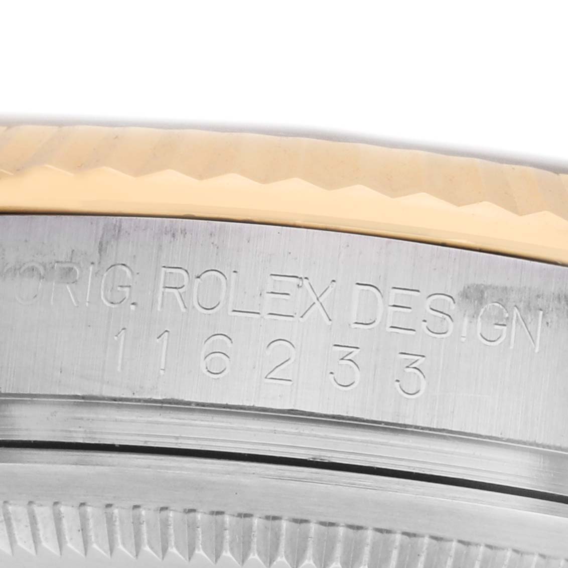 The image shows a close-up of the case side of a Rolex Datejust 116233 Men's Stainless Steel Grey Dial, focusing on the engraved model number and the fluted bezel.