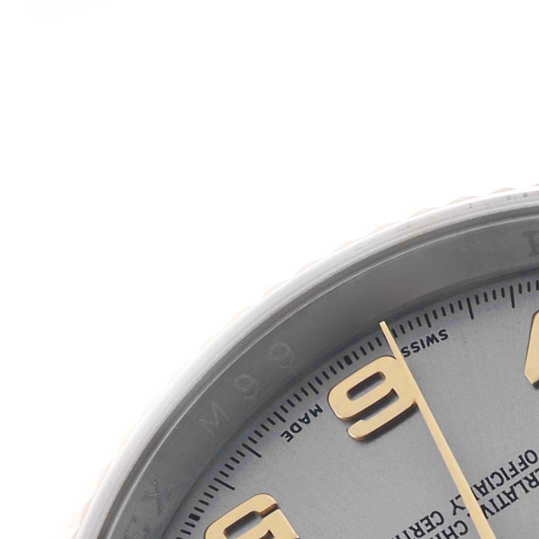 The image shows a close-up of the edge of a Rolex Datejust 116233 Men's Stainless Steel Grey Dial dial, highlighting the hour markers and part of the bezel.