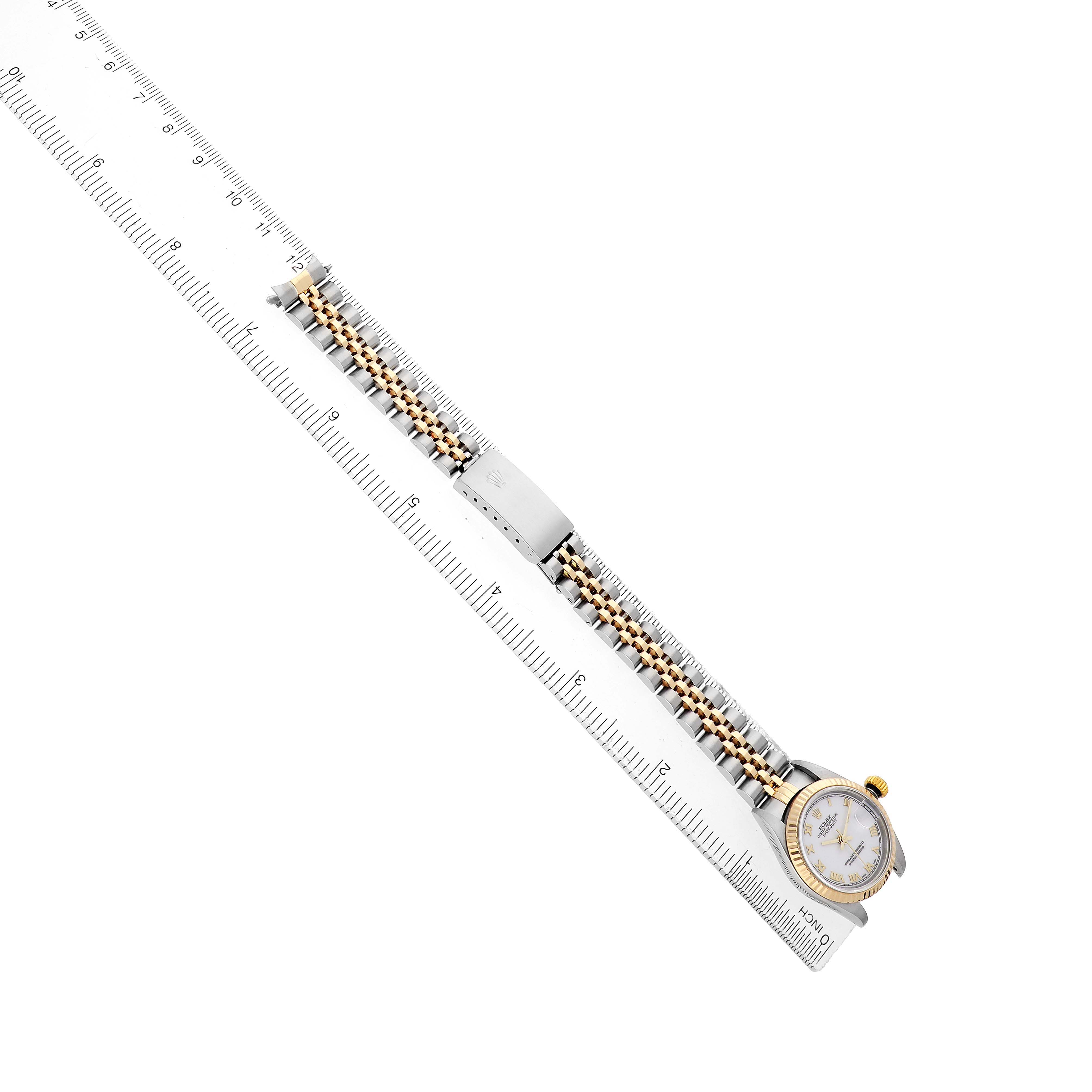 The Rolex Datejust 79173 Women's Stainless Steel White Dial watch is shown from an angled top view, highlighting the bracelet, clasp, and partial face.