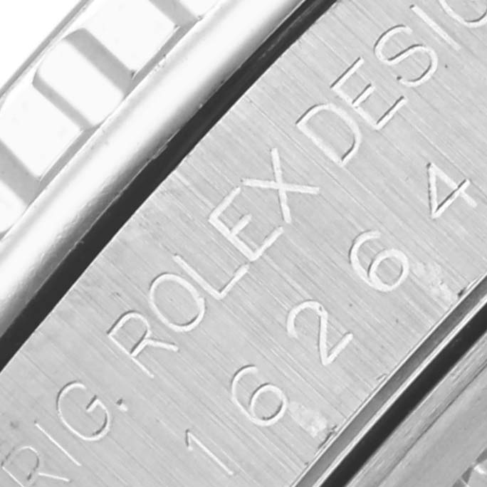 The image shows a close-up of the polished side edge of a Rolex Turn-o-Graph 16264 Men's Stainless Steel Silver Dial 16264 Men's Stainless Steel Silver Dial, detailing the bezel and engraved text.