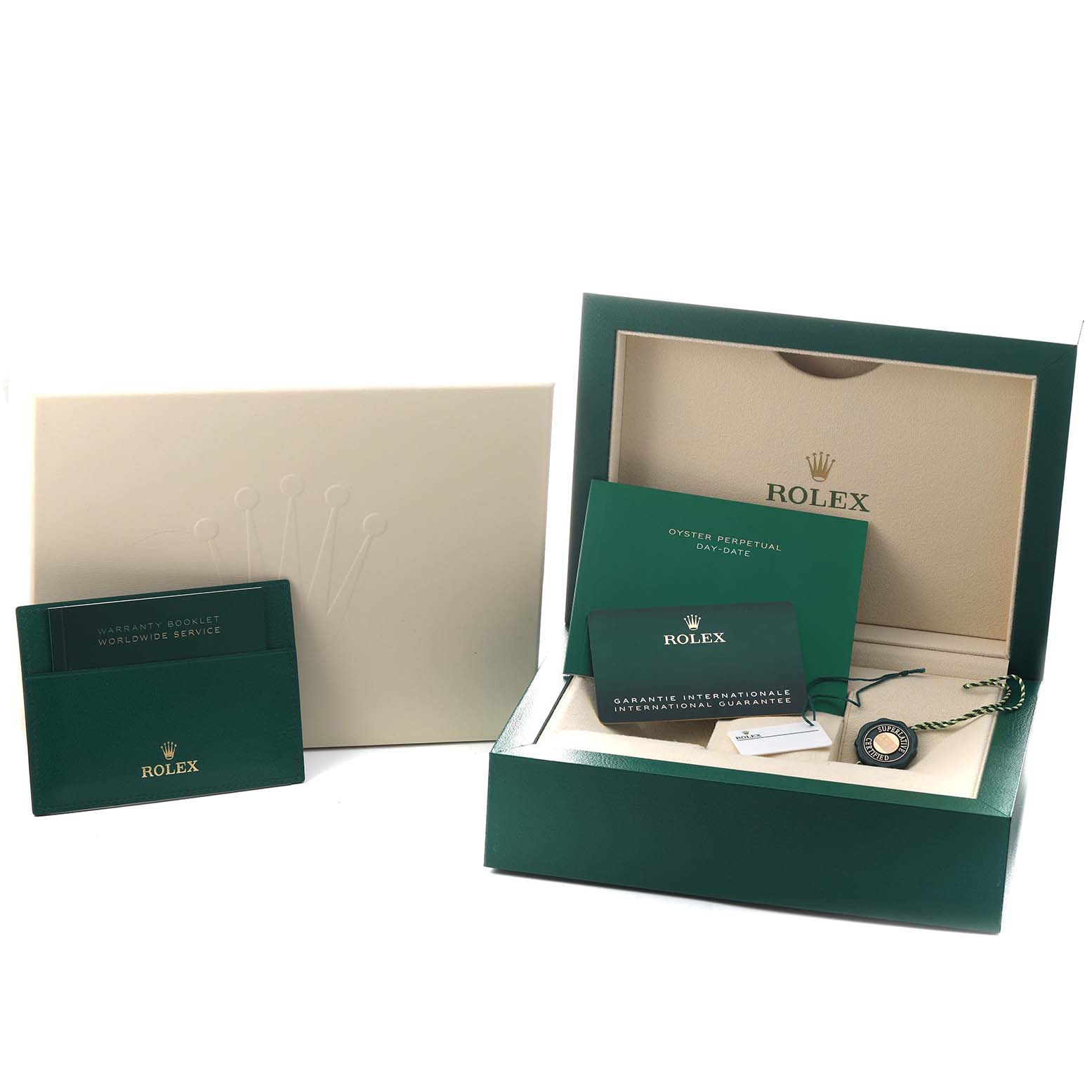 The image shows the packaging and documentation for the Rolex President 228235 Men's Rose Gold Green Dial model, including the box, warranty booklet, and tags.