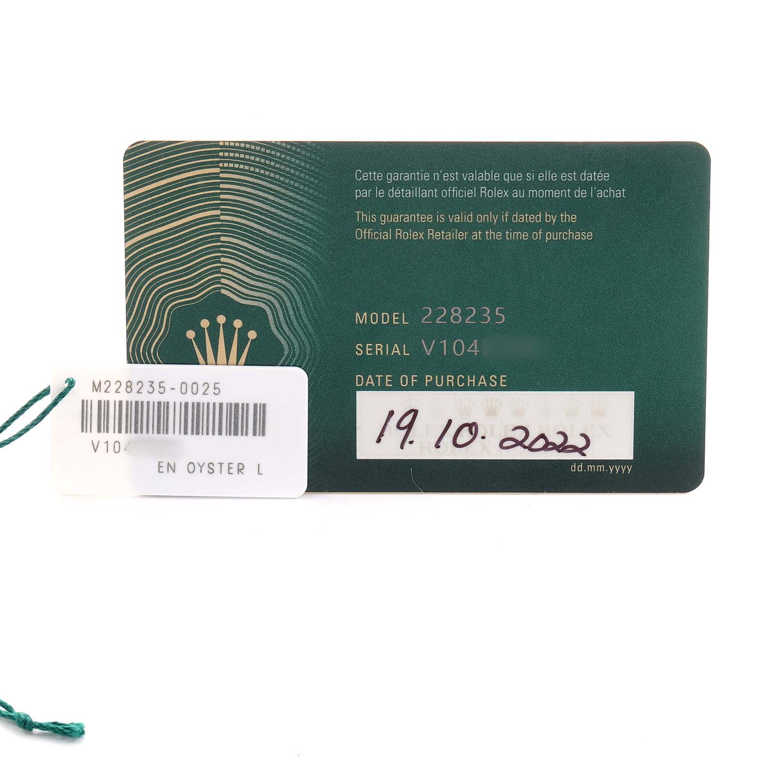 The image shows the warranty card and tag of a Rolex President 228235 Men's Rose Gold Green Dial model, highlighting model and serial numbers.