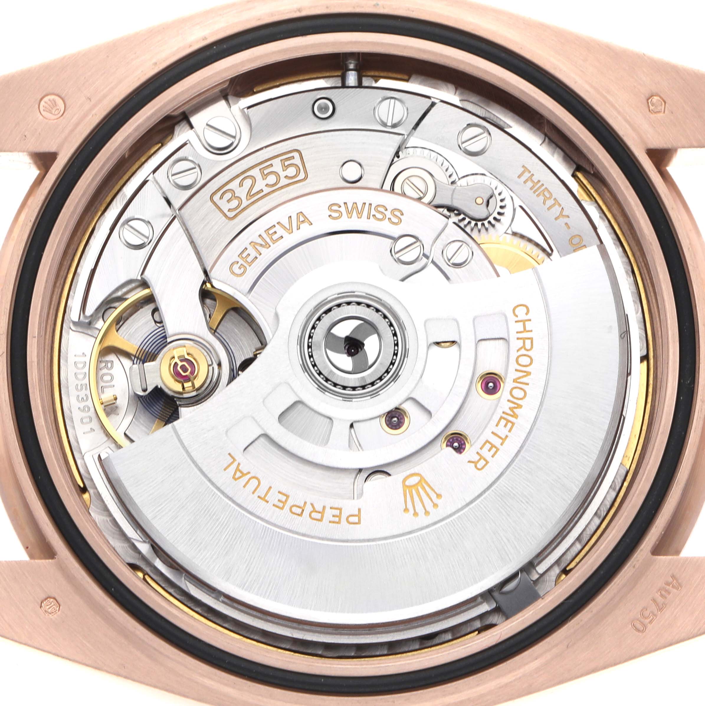 The image shows the movement mechanism of the Rolex President 228235 Men's Rose Gold Green Dial model, focusing on the intricate inner workings.