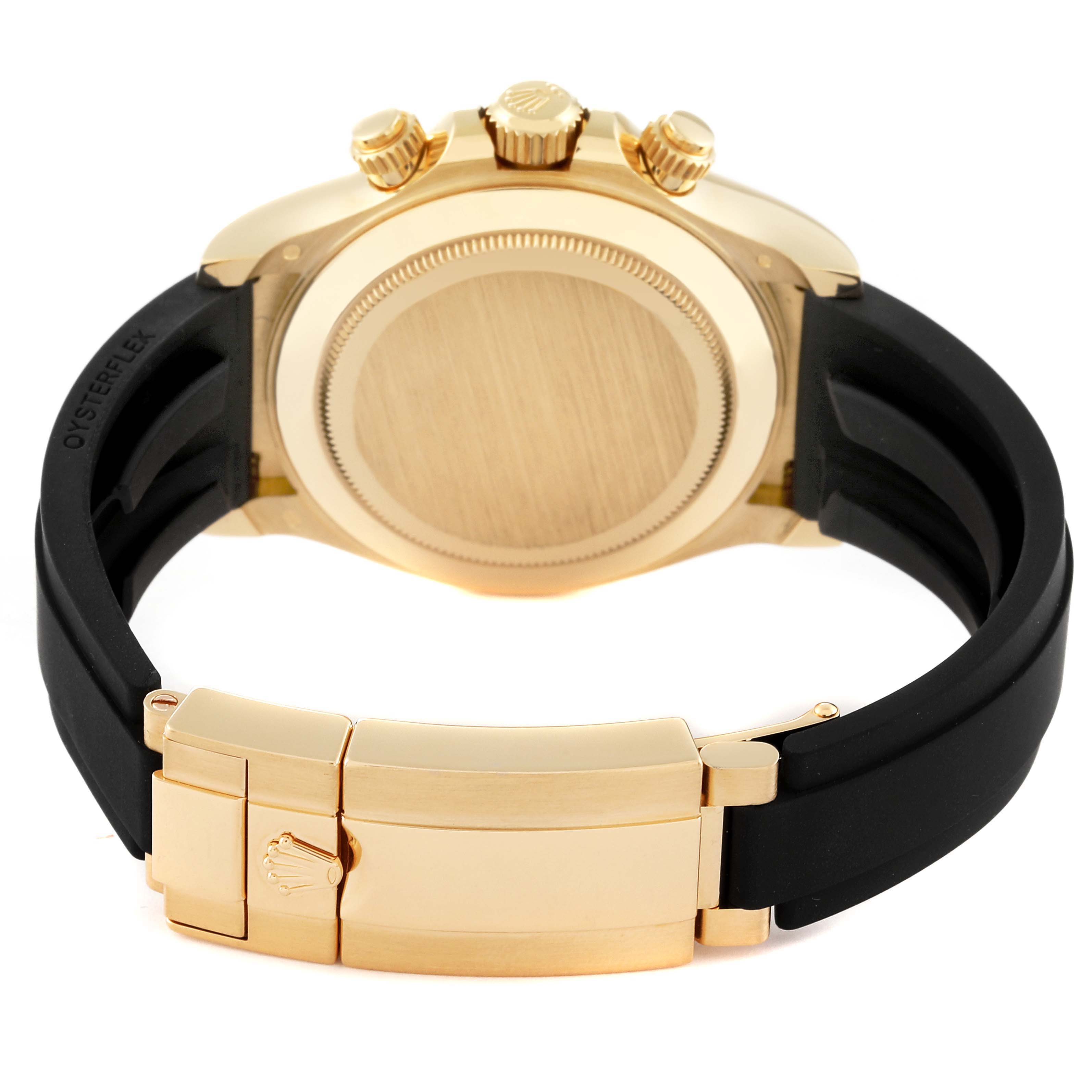 The image shows the back and clasp of a Rolex Daytona 116518LN Men's Yellow Gold Champagne Dial 116518LN Men's Yellow Gold Champagne Dial watch, including the caseback, crown, and part of the black strap.