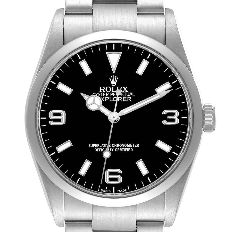 The Rolex Explorer watch is shown from a front angle, displaying the black dial, numerals, and stainless steel bracelet.