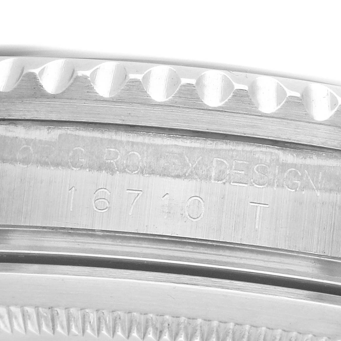 The image shows the side view of the case with engraved details of a Rolex GMT-Master 16710 Men's Stainless Steel Black Dial model.