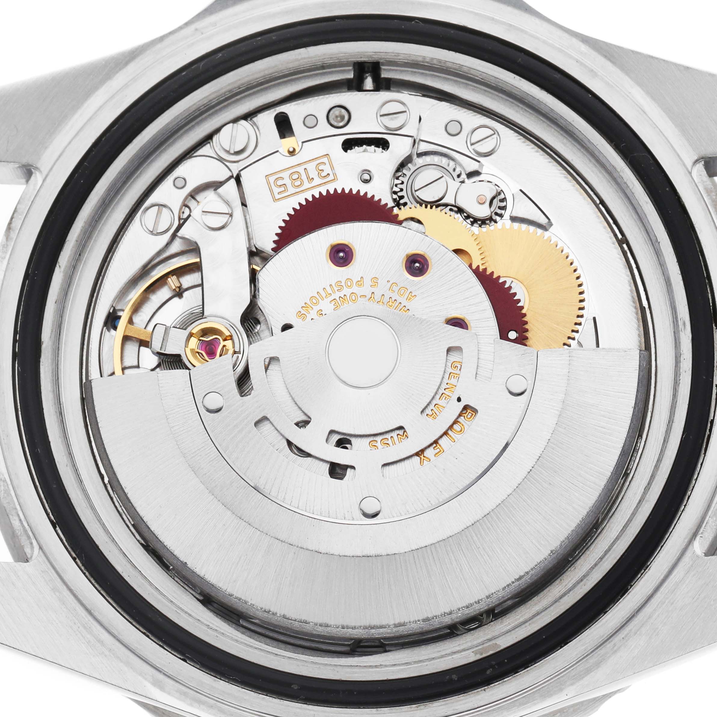 The image shows the back of a Rolex GMT-Master 16710 Men's Stainless Steel Black Dial watch, revealing its intricate movement mechanism.