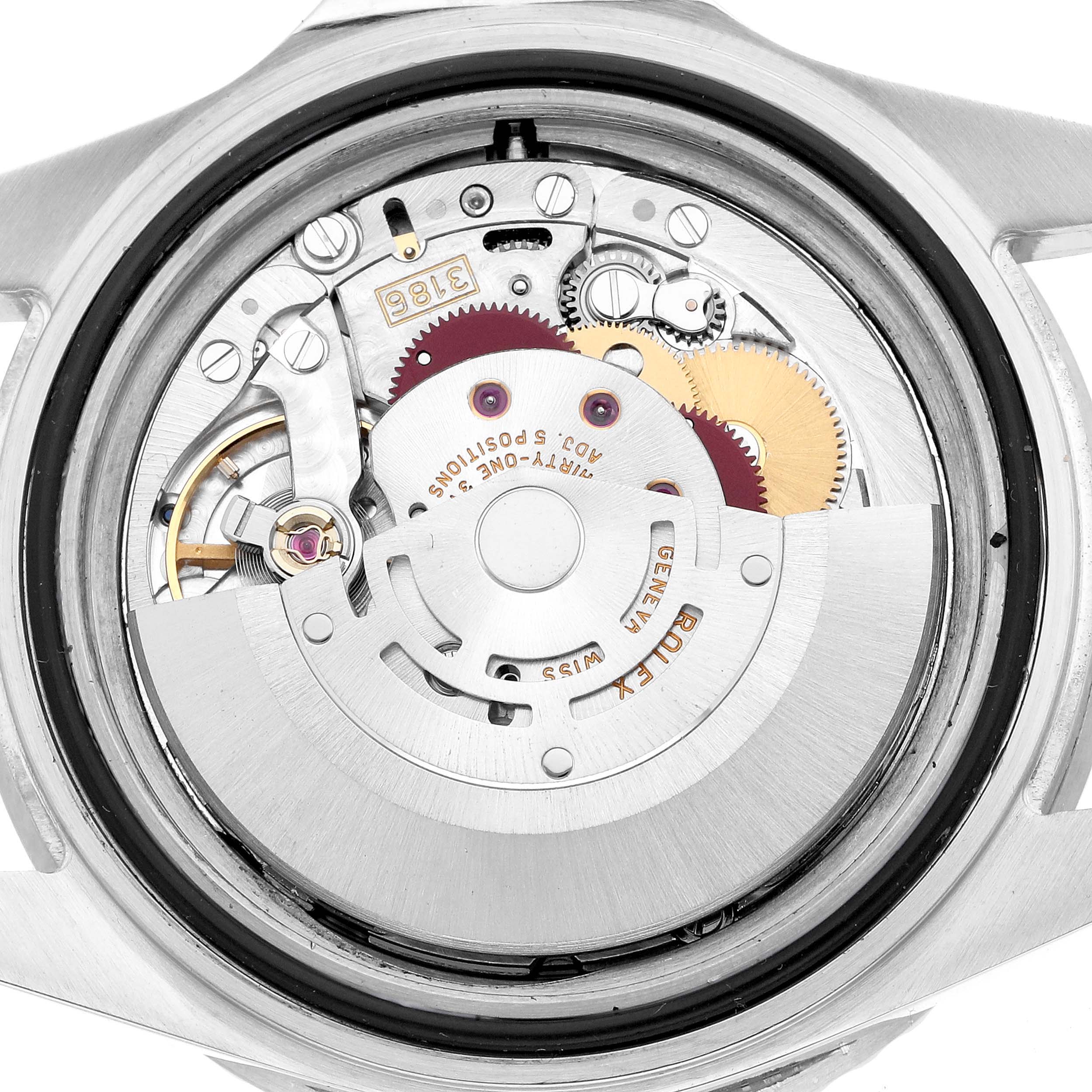 The image shows the internal movement of a Rolex GMT-Master 16710 Men's Stainless Steel Black Dial watch from a back angle, highlighting gears and the rotor.