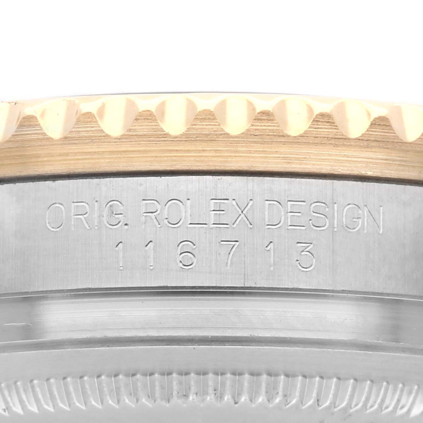The image shows a close-up of the side of a Rolex GMT-Master 116713 Men's Steel and Gold (two tone) Black Dial 116713 Men's Steel and Gold (two tone) Black Dial watch case, highlighting the model number and part of the bezel.
