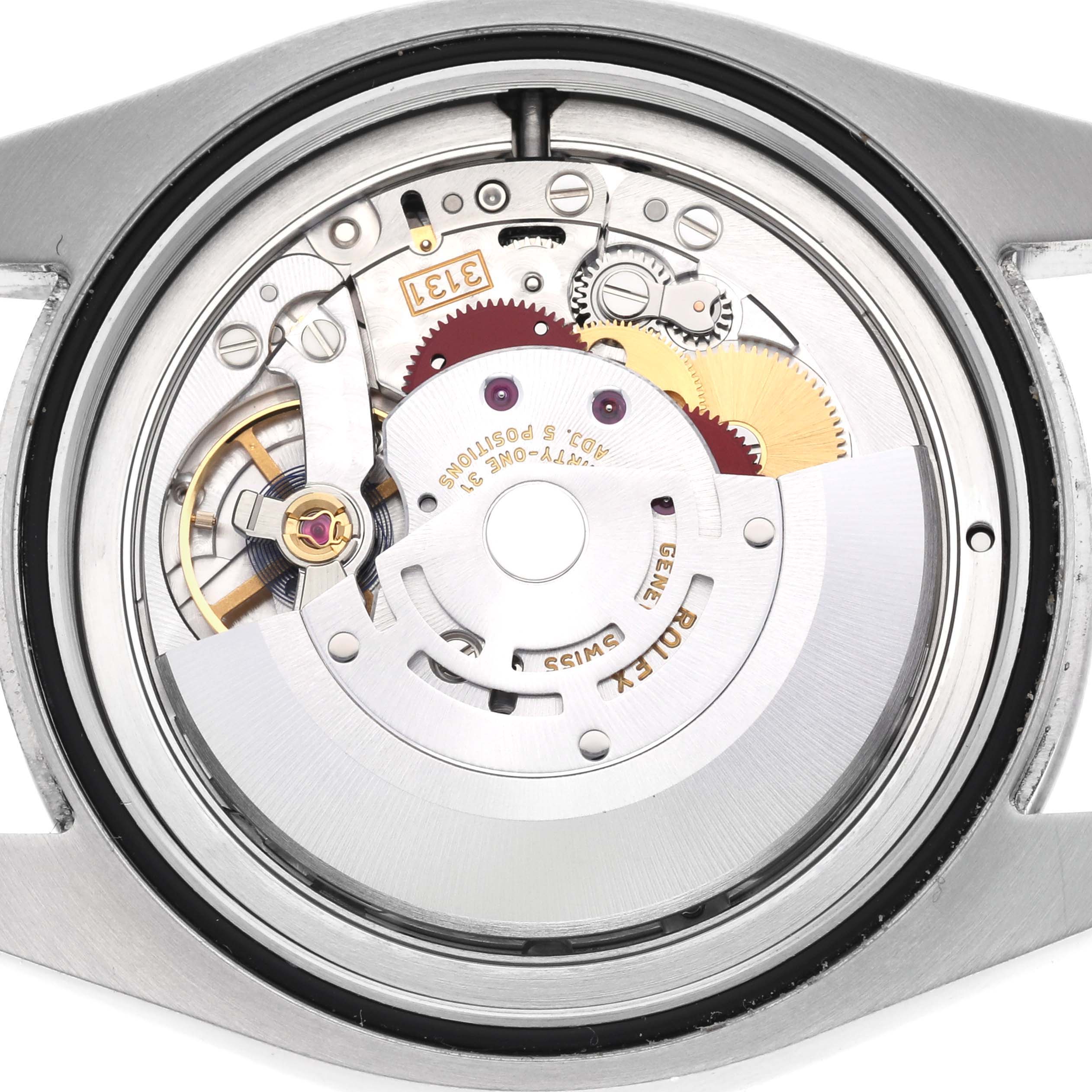 The image shows the inner mechanics of the Rolex Air-King 116900 Men's Stainless Steel Black Dial 116900 Men's Stainless Steel Black Dial watch from a rear angle, highlighting its movement components.