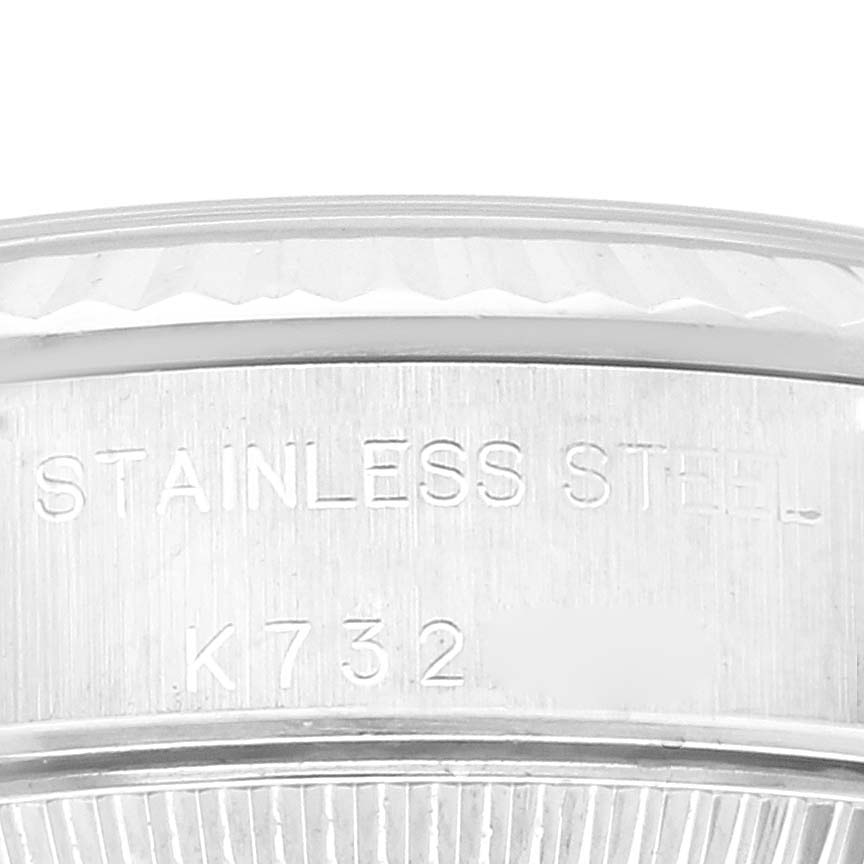 The image shows a close-up of the stainless steel casing and part of the fluted bezel of a Rolex Oyster Perpetual 76094 Women's Stainless Steel Blue Dial 76094 Women's Stainless Steel Blue Dial watch.